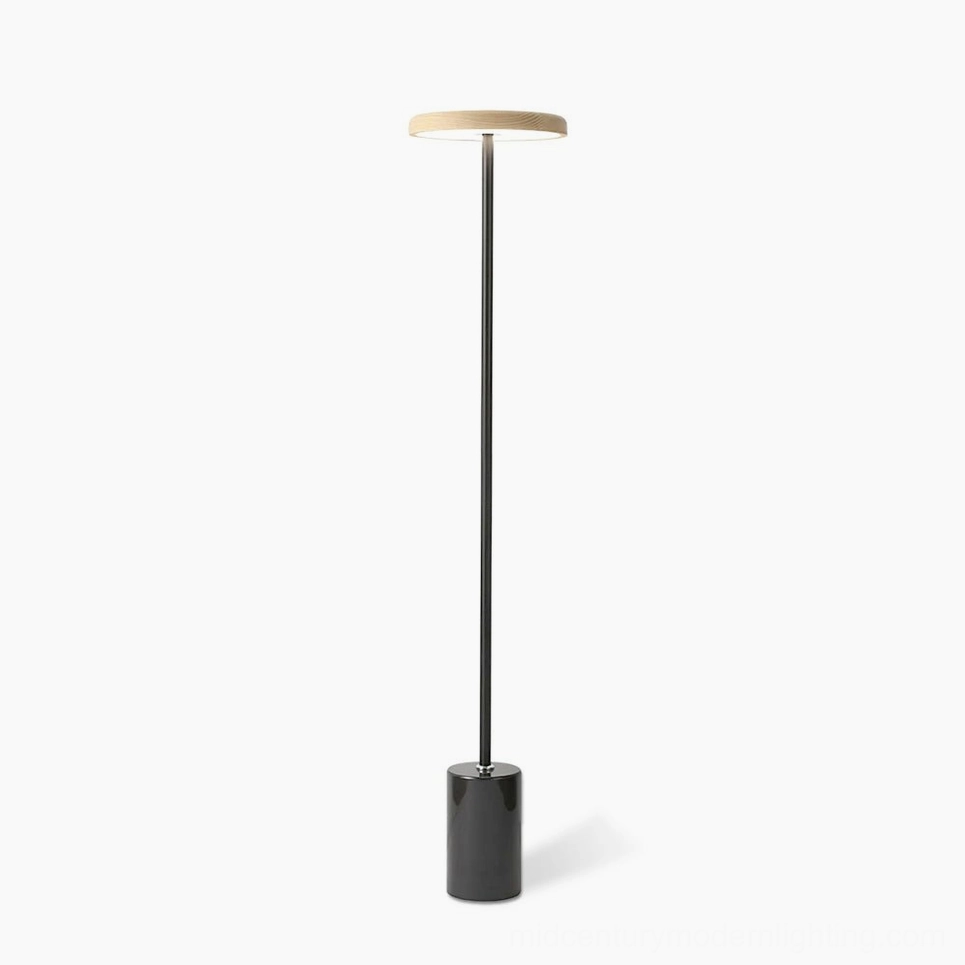 Oblique modern floor lamp with minimalist black metal pole and marble base, studio shot on white background showing the lamp's elegant geometric silhouette