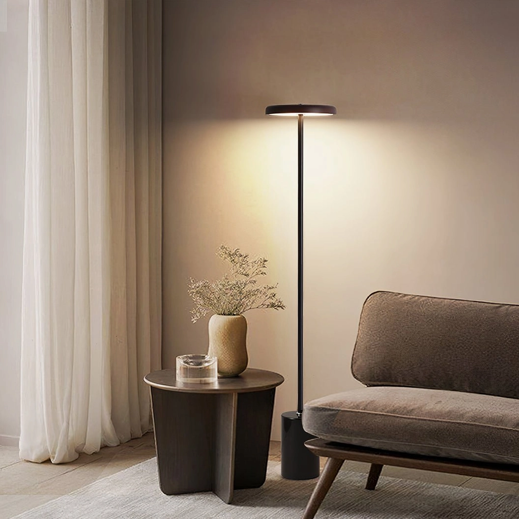 Scandinavian floor lamp in cozy lounge corner with decorative plants, warm neutral interior styling, contemporary home decor