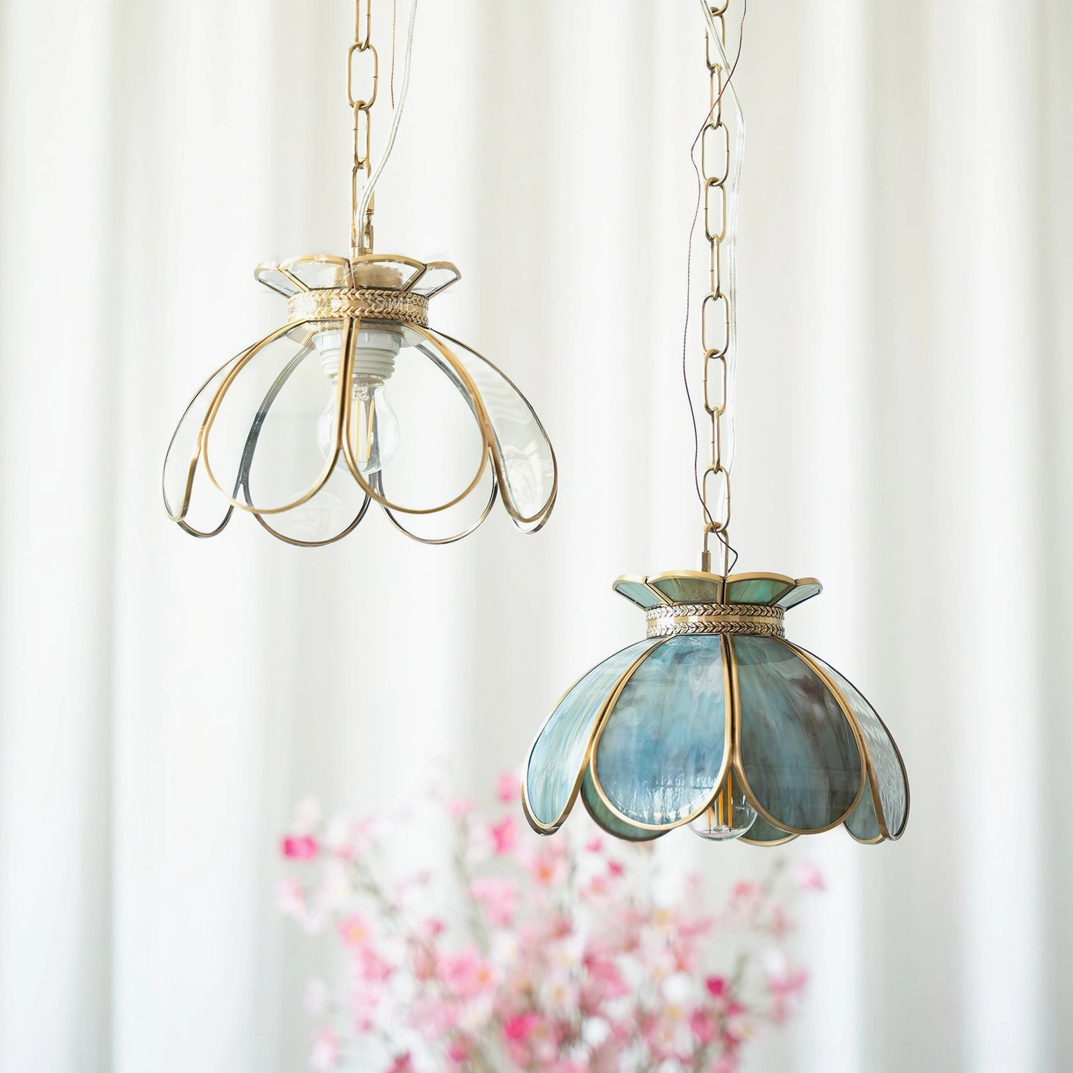 Odette lotus pendant light in warm gold-amber stained glass with honeyed glow and vintage brass trim