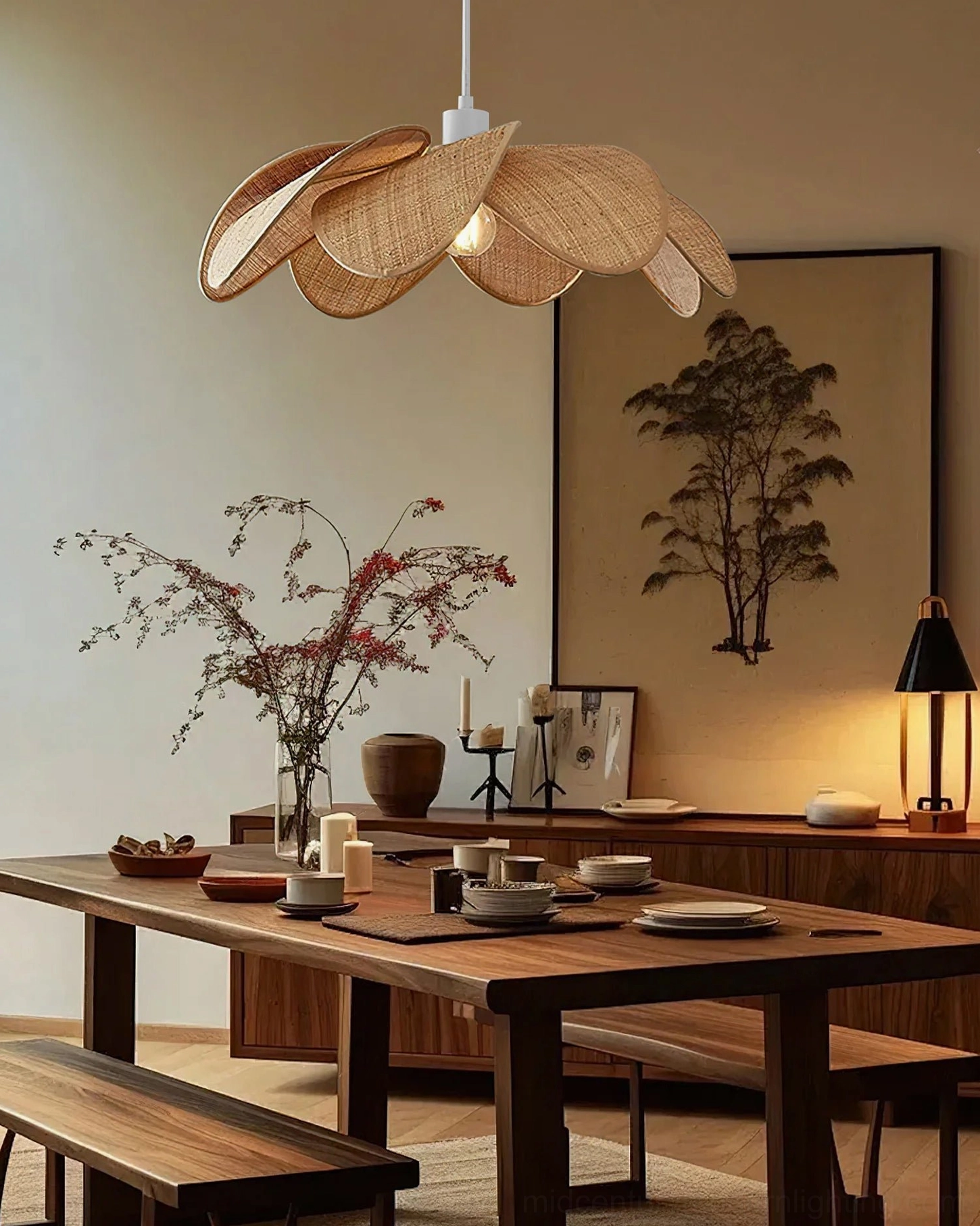 Odilia rattan pendant light in decorated dining room with wall art, japandi bohemian home style, low front view showing warm ambient lighting