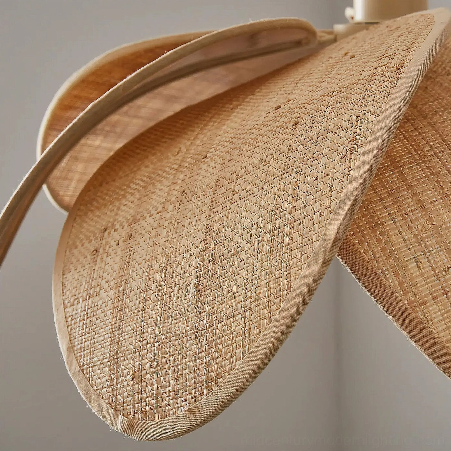 Odilia rattan pendant light side close-up, detailed view of handwoven rattan petal texture, natural fiber weaving pattern and craftsmanship