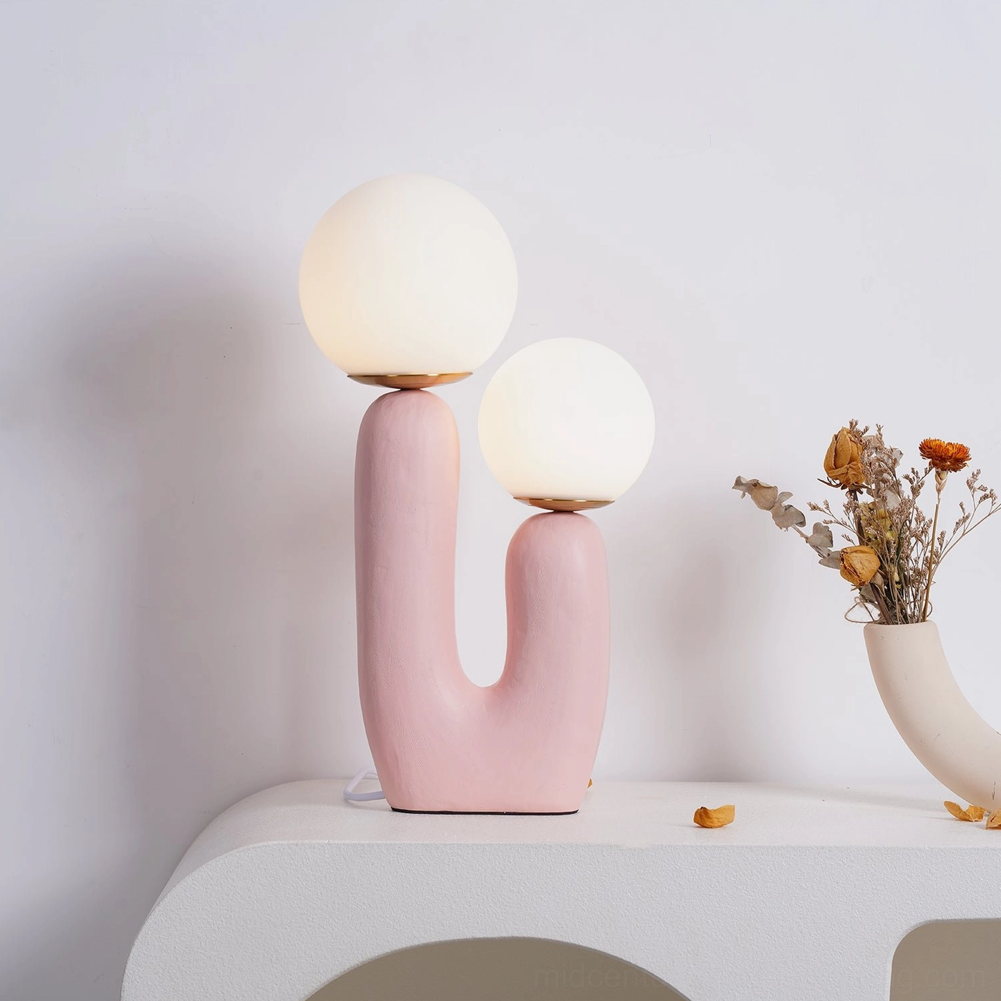 Oo pink ceramic table lamp on minimalist white tabletop styled display