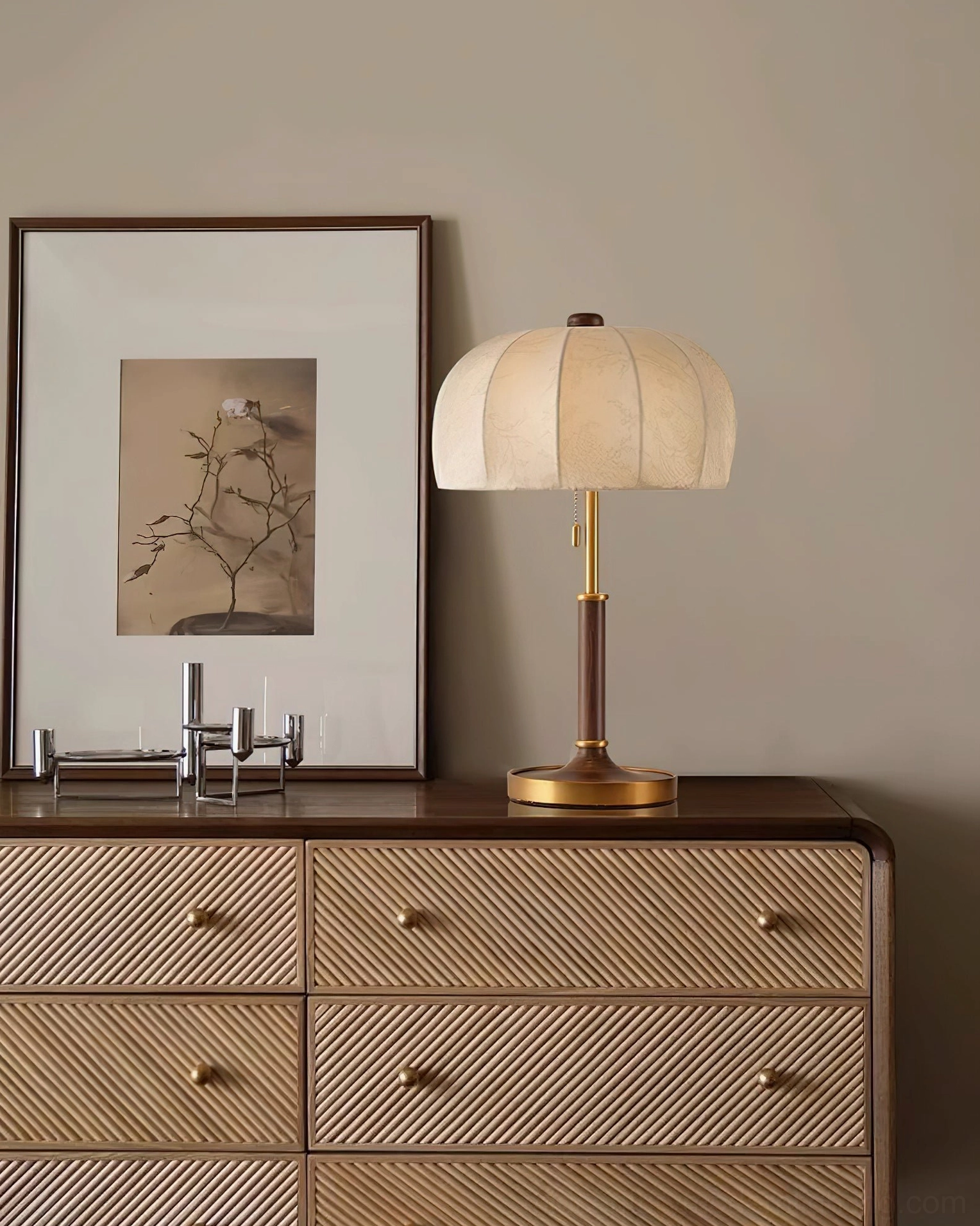 Pumpkin fabric table lamp with brass base and minimalist retro design on light luxury wooden cabinet