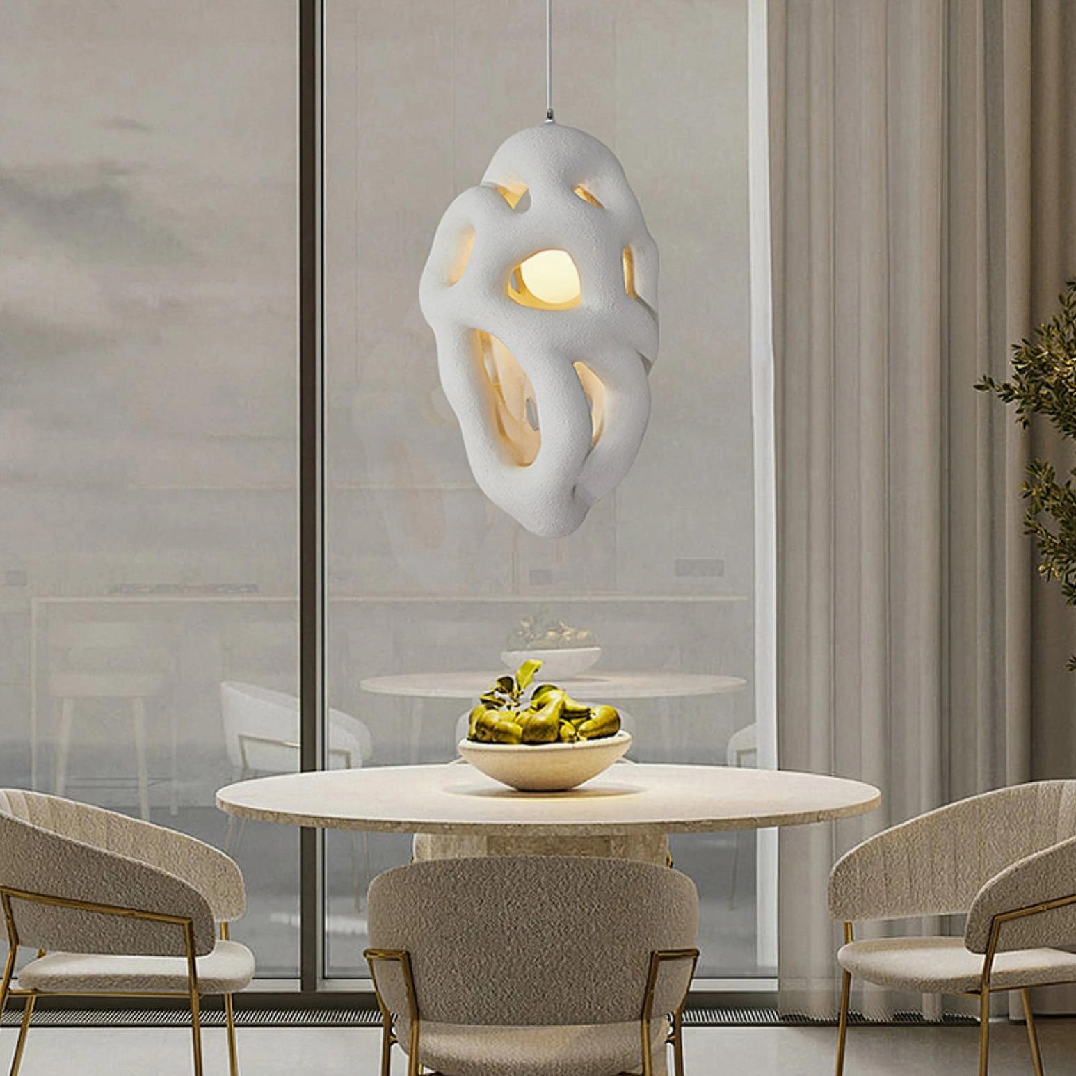Organic nest pendant installed in glass-walled dining room with minimalist warm neutral decor
