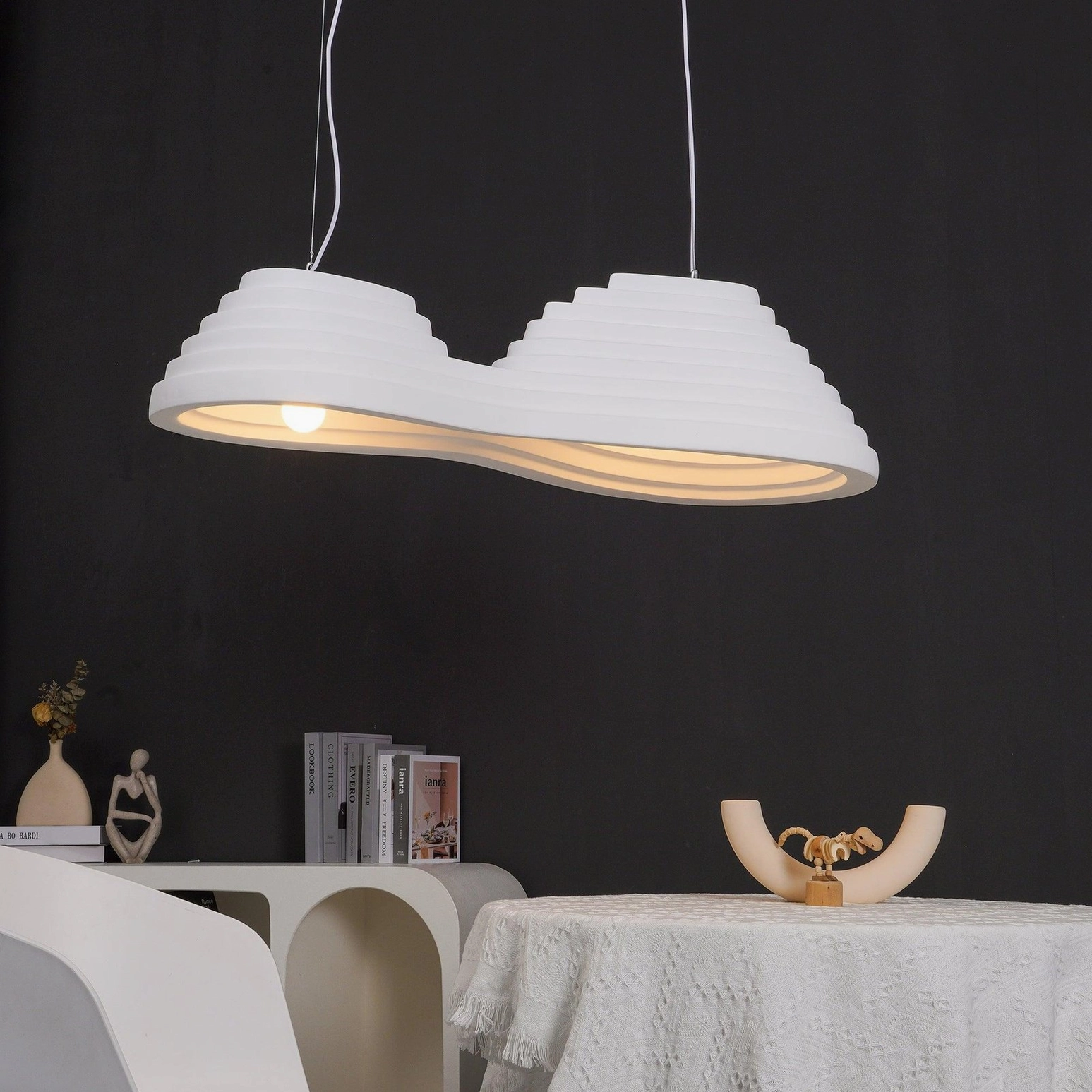 Organic tiered pendant light in contemporary interior setting demonstrating versatile design application