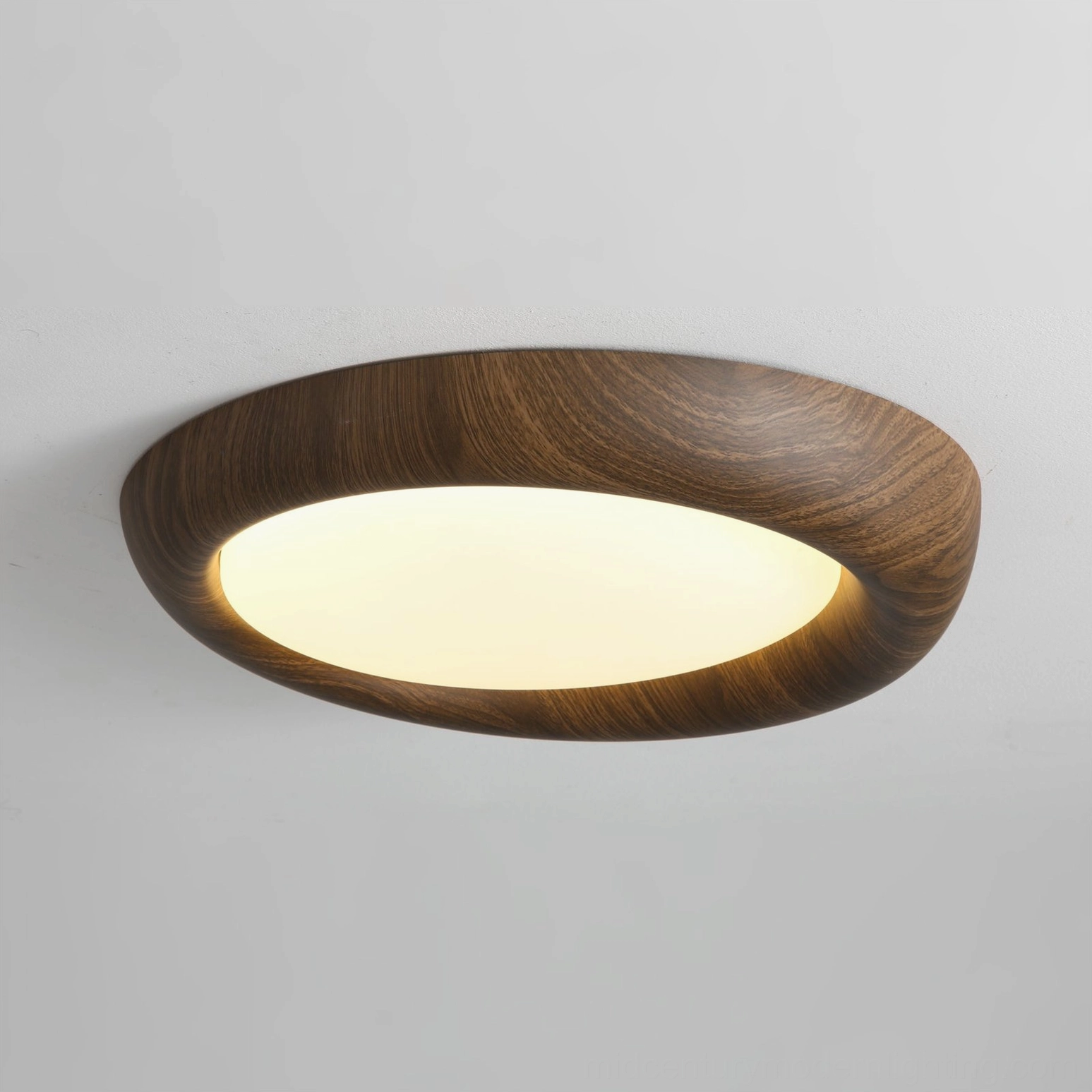 Vikaey oval wood grain ceiling light with curved frame, side angle studio photography