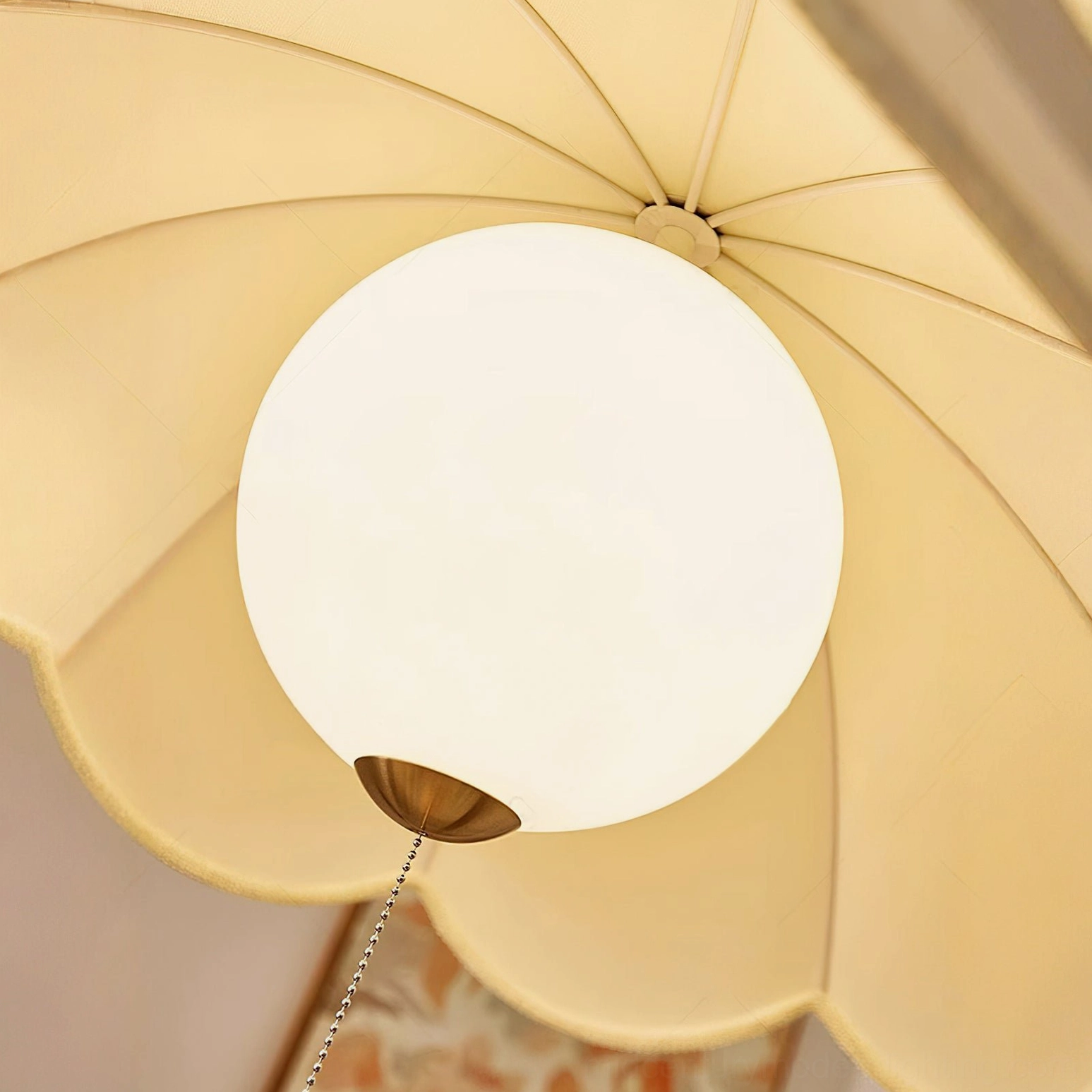 Oriente pendant light architectural detail showing brass chain suspension and wooden canopy