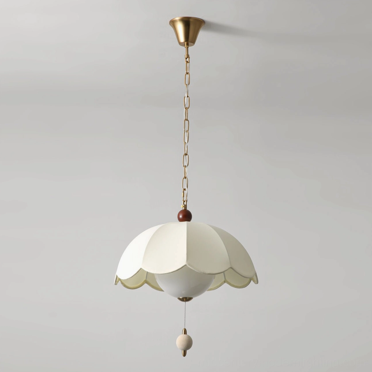 Oriente mid-century pendant light with off-white scalloped shade in minimalist white setting
