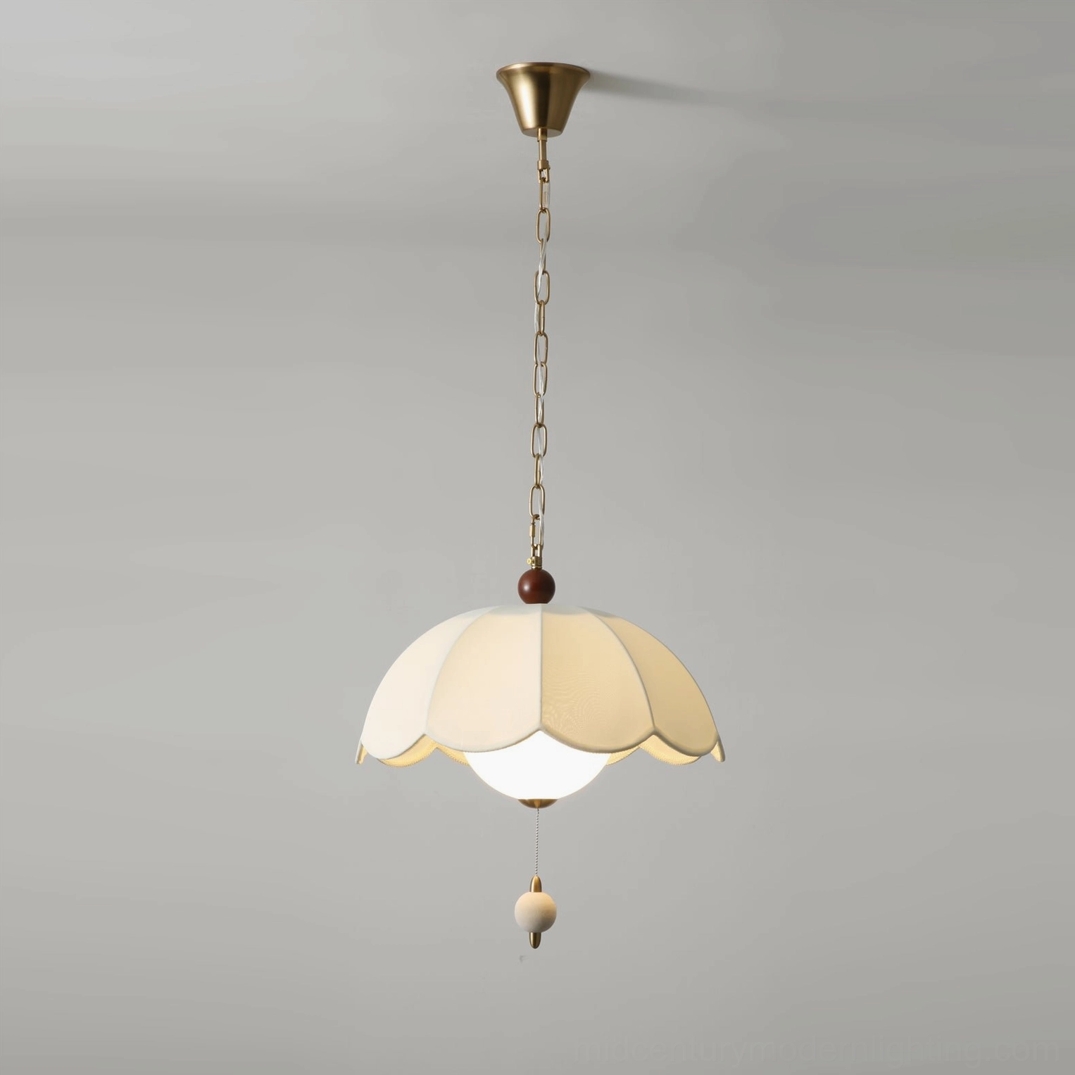 Oriente pendant ceiling light with spherical fabric pull and brass mounting hardware detail