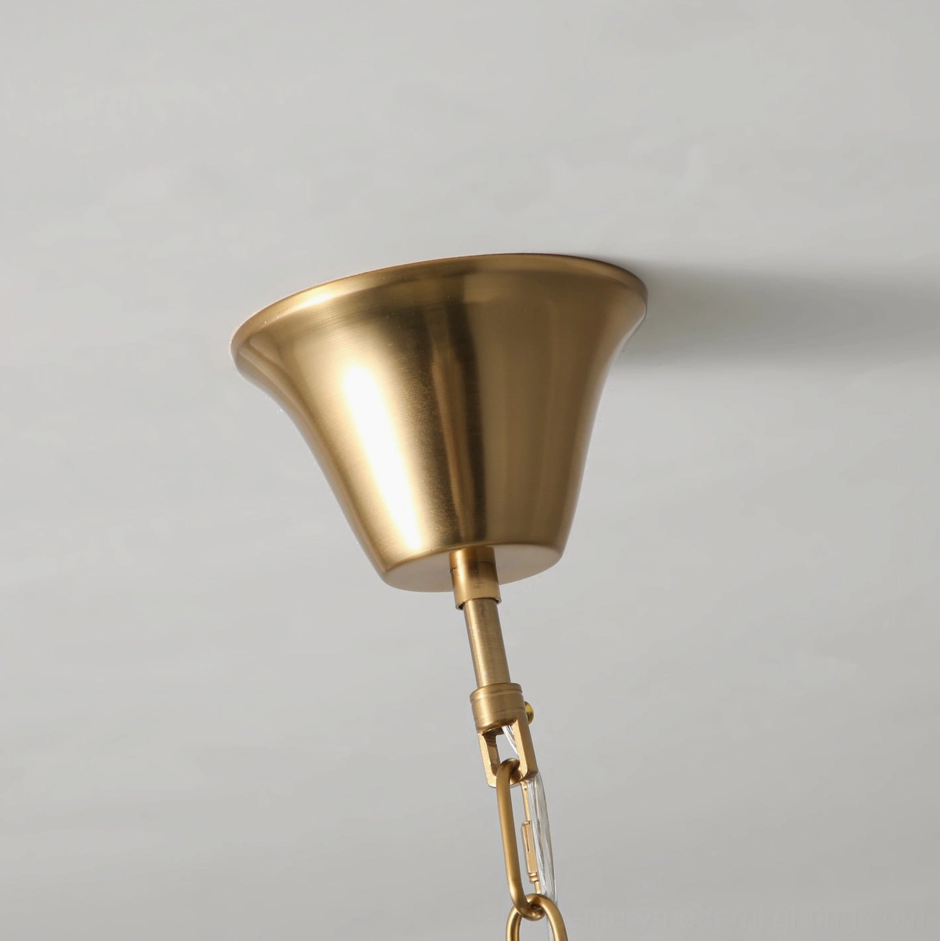 Oriente pendant light showing scalloped shade construction and internal bulb illumination