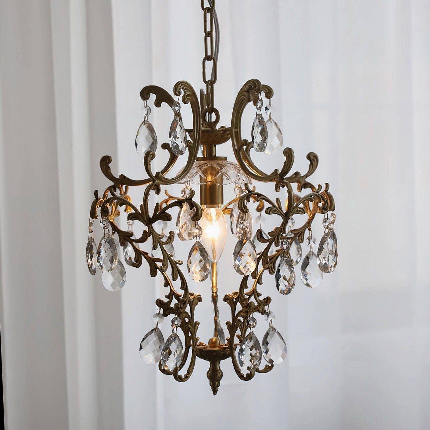 Ornate antique brass birdcage pendant with clear crystal teardrop embellishments and elegant silhouette
