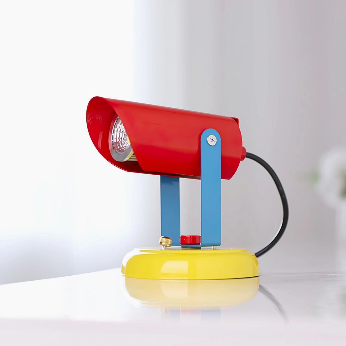 Orno color block table lamp freestanding three-quarter front view on glossy white tabletop surface