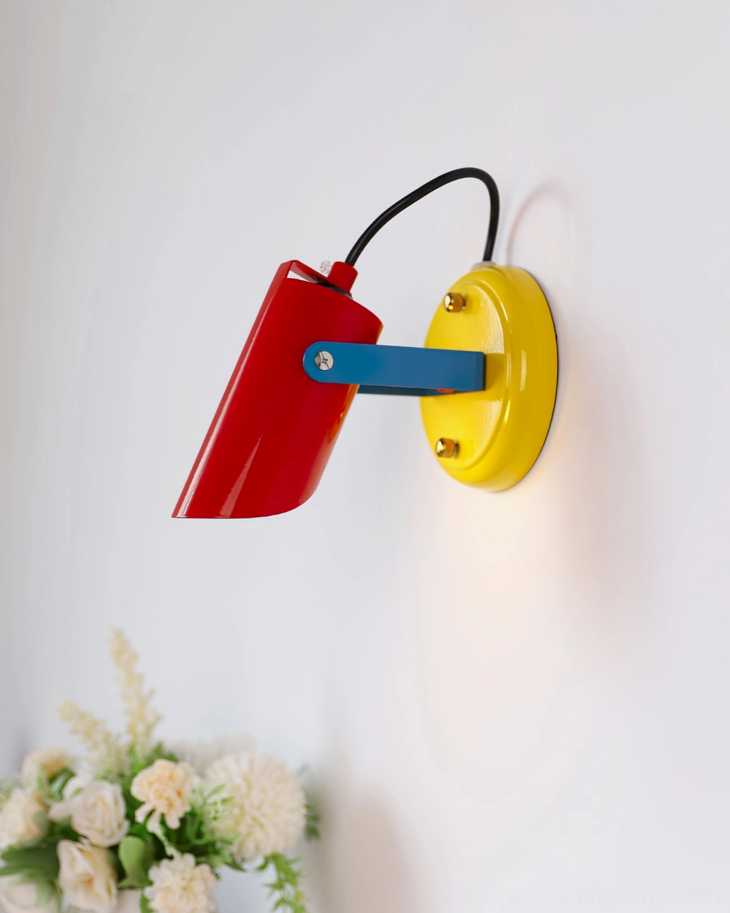 Orno mini wall lamp rear side view compact red yellow blue design on home interior wall with flower decoration