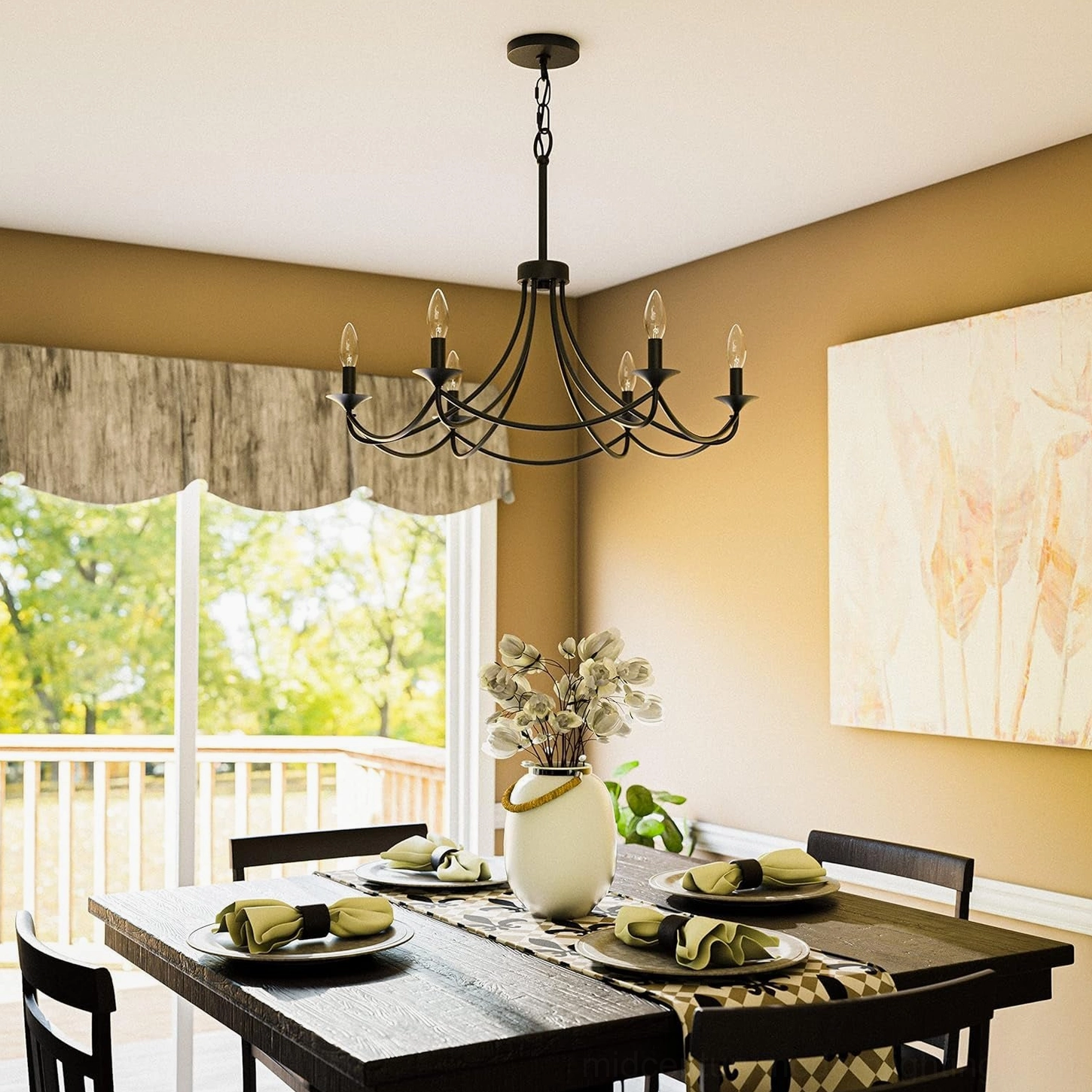 Black candle chandelier in cozy dining space with tan walls, large windows, and neutral farmhouse decor