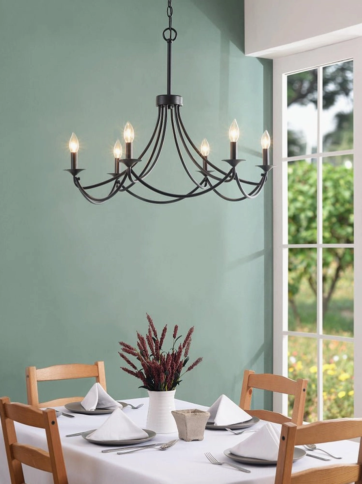 Ottuso six-light black chandelier in small dining room with teal walls and minimalist rustic lighting style