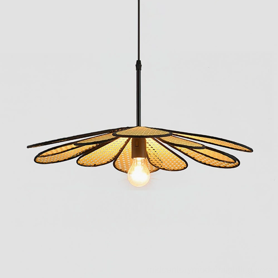Oversized 80cm handwoven rattan flower pendant above expansive dining table with warm ambient illumination