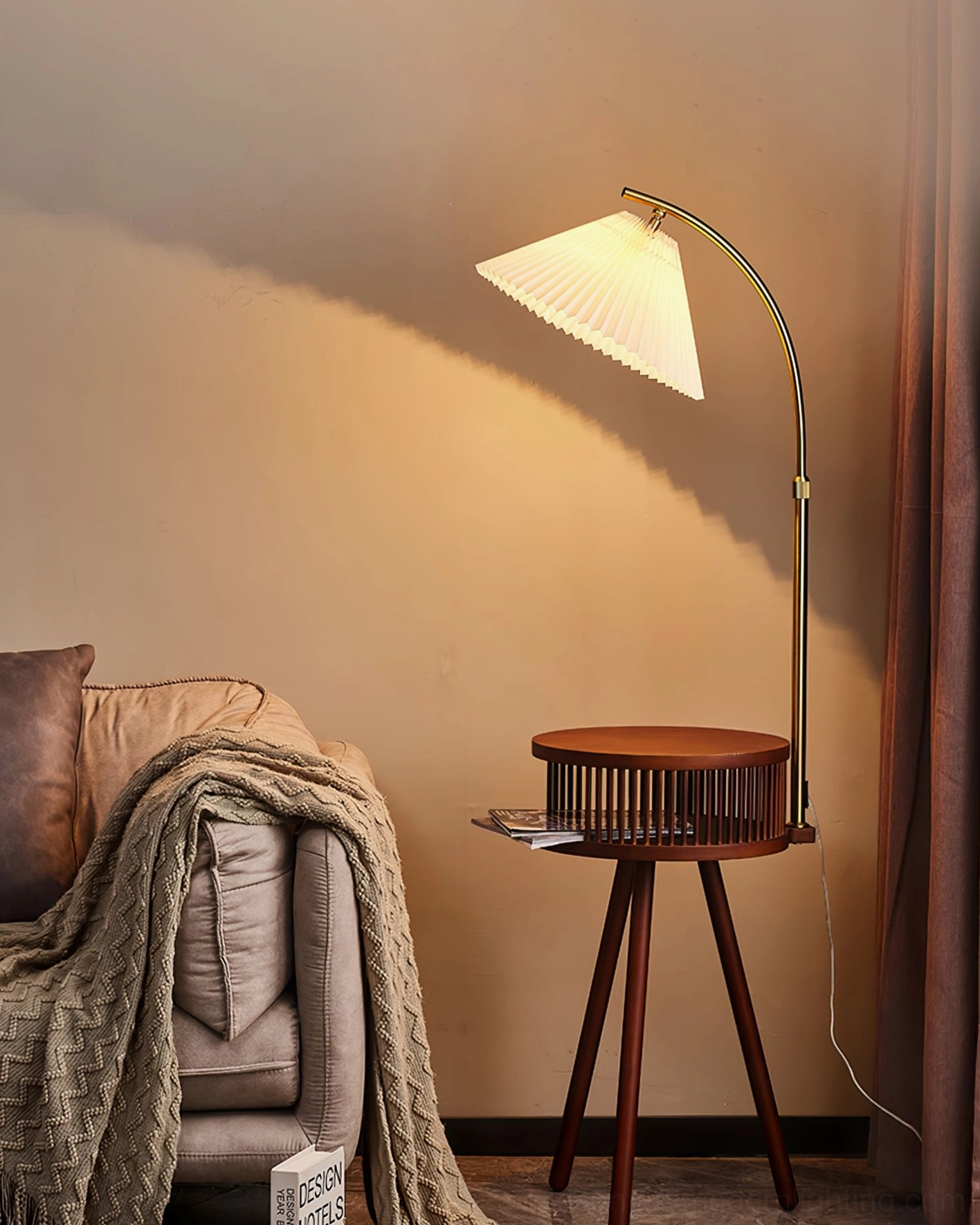 Ozawa floor lamp with fabric shade positioned beside sofa with throw blanket in modern living space