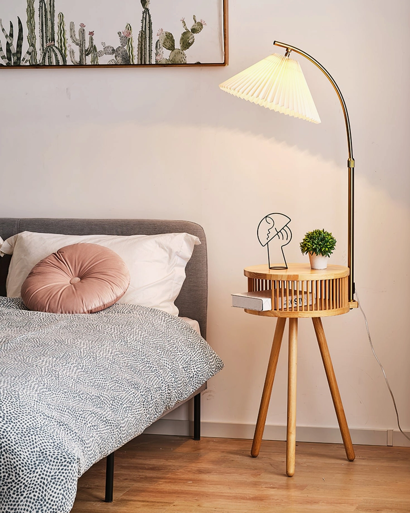 Ozawa mid-century floor lamp with natural wood base in bedroom bedside setup with decorative plants