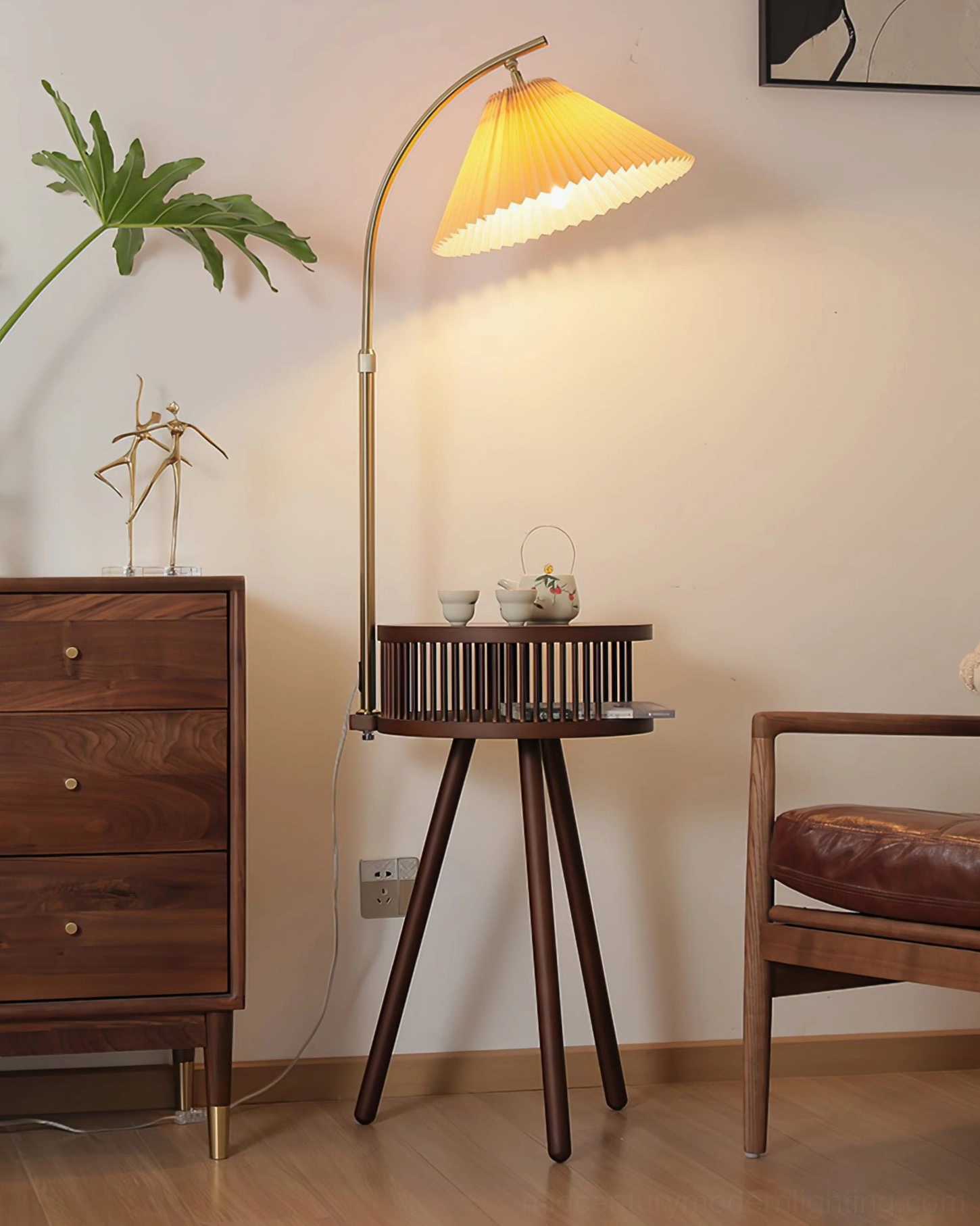 Ozawa floor lamp with walnut base and lit pleated shade in living room corner design setup