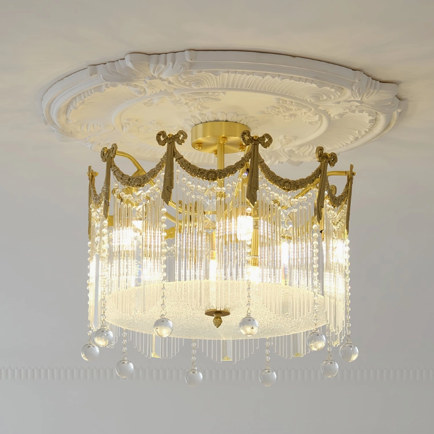 Crystal ceiling lamp installed on ornate palace-style ceiling with decorative gypsum trim