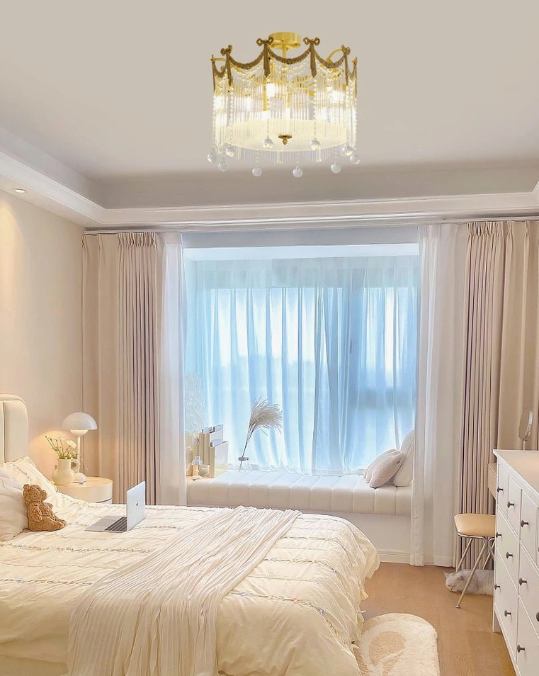 Brass crystal water drop ceiling lamp in French cozy master bedroom with warm neutral tones