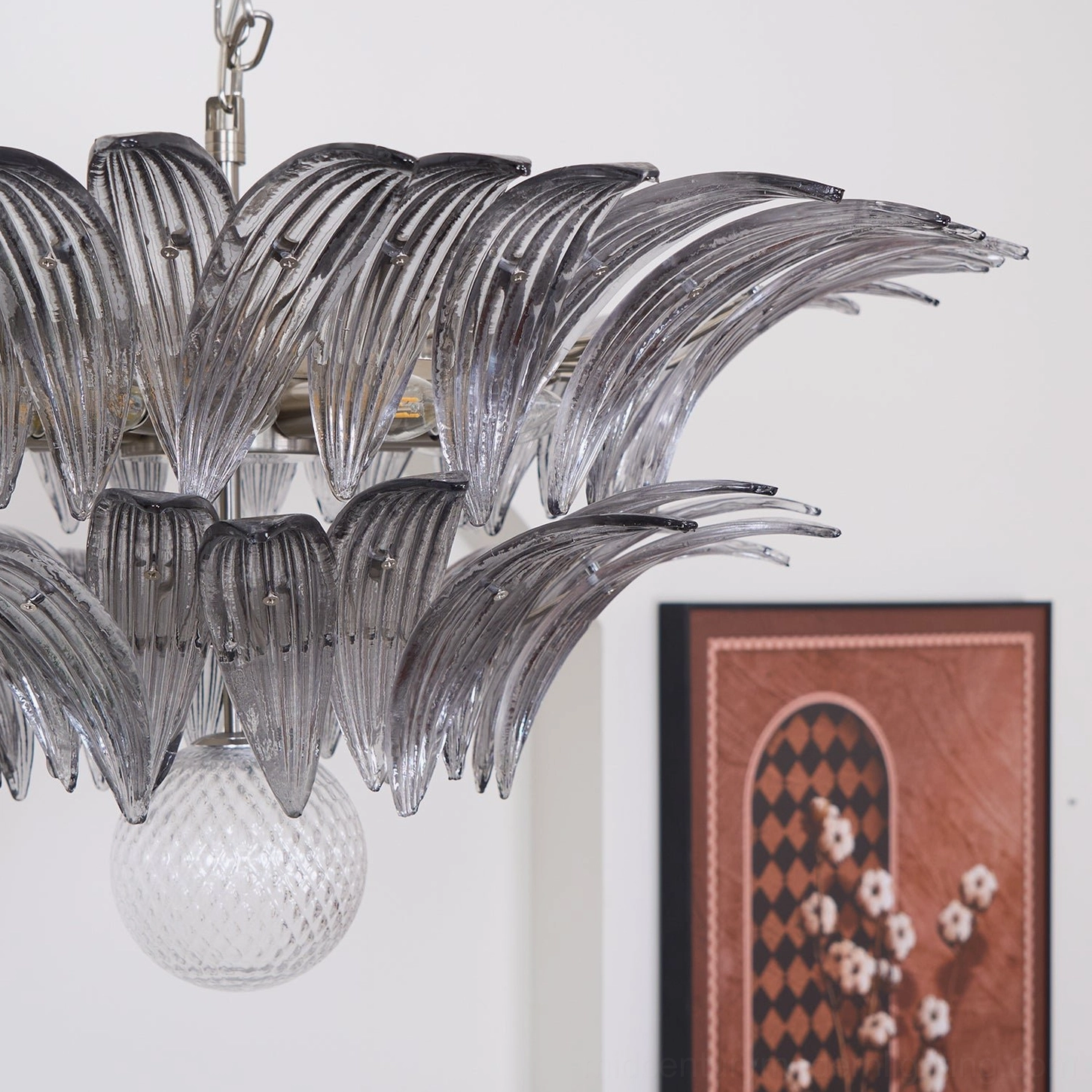 Full view of Palazzo Ball Chandelier with glass leaf panels radiating from central frame in luxury interior