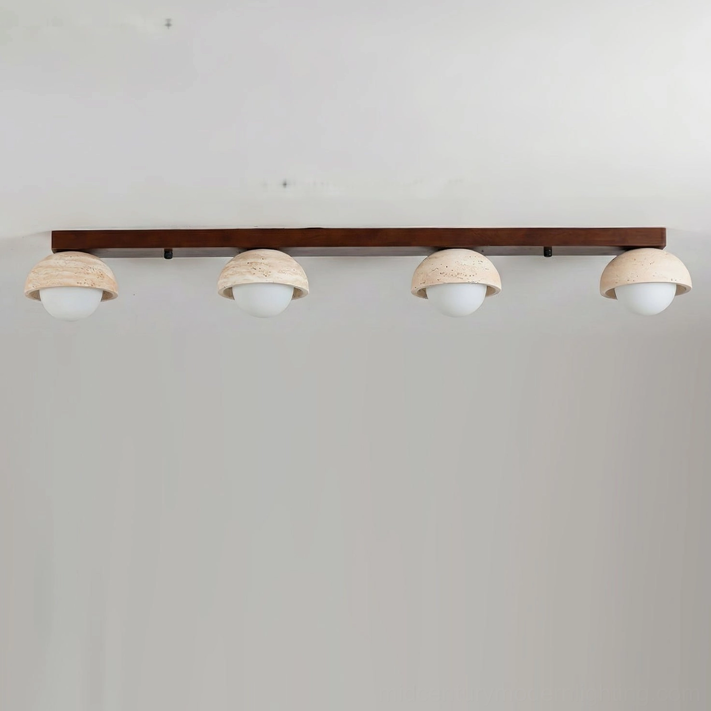 Palermo linear ceiling light close-up showing travertine dome texture and frosted glass globe detail