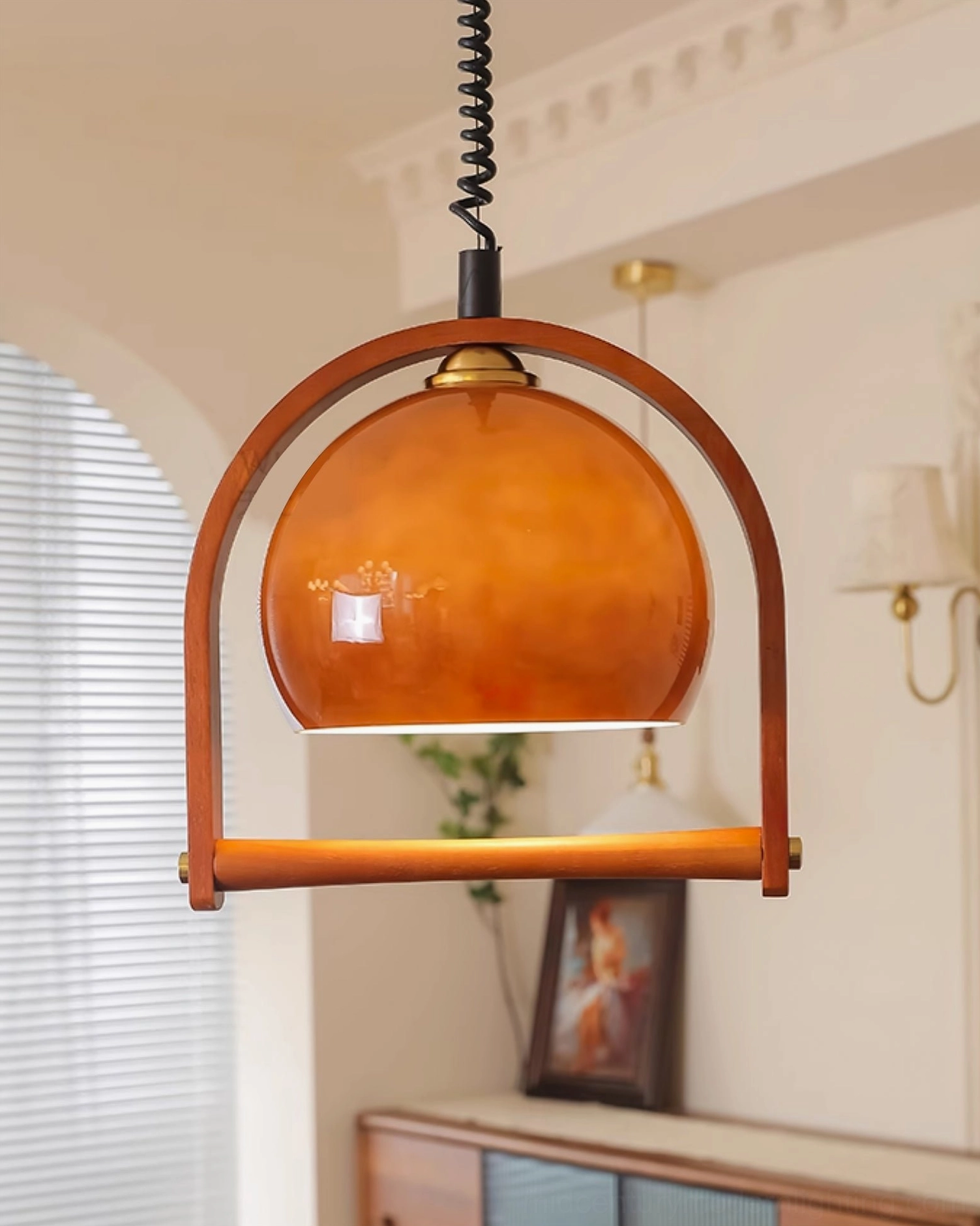 Pallade pendant lamp adjustable spiral cord detail with polished brass accents at eye level