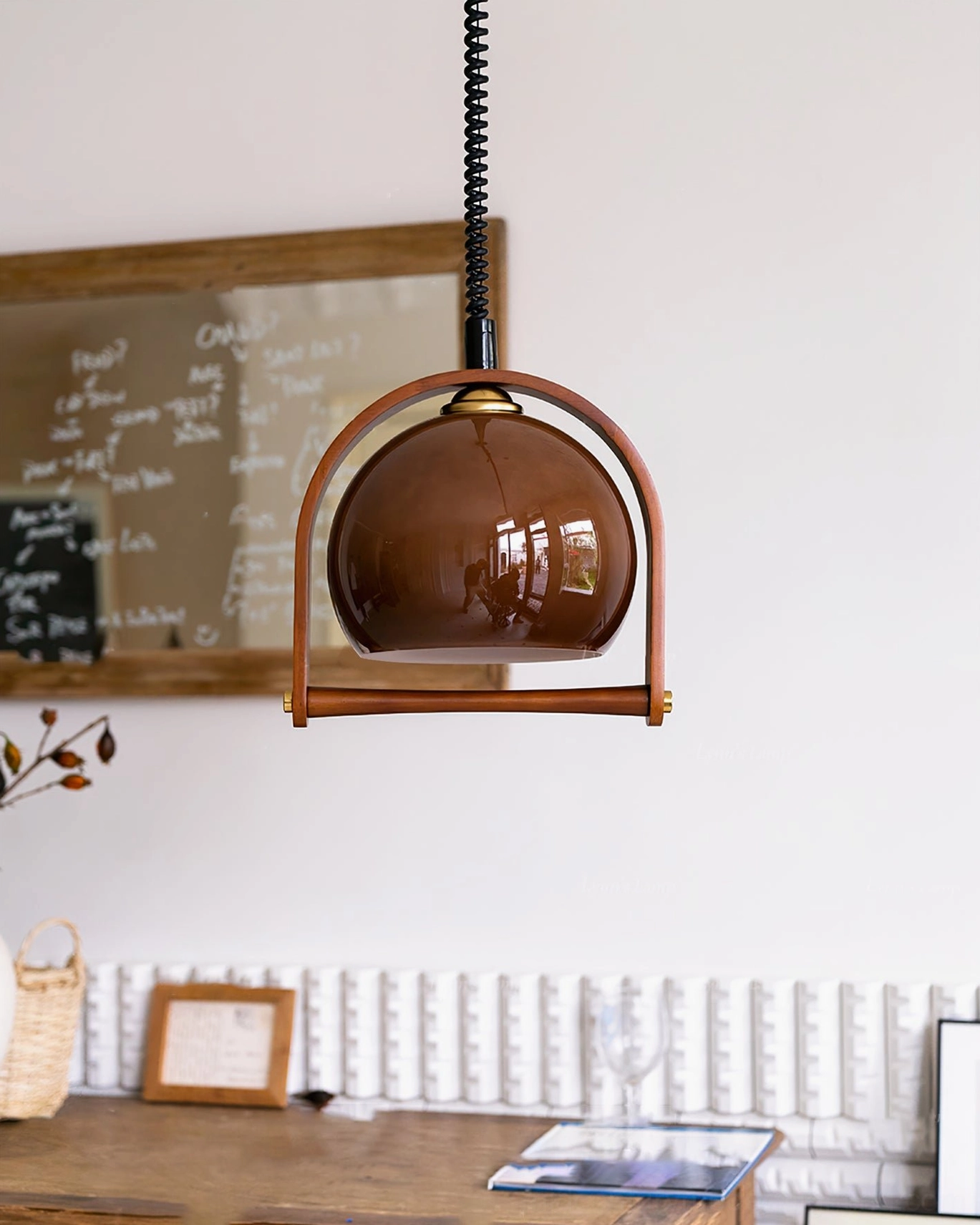 Pallade mid-century modern pendant light full fixture display with warm amber glow effect