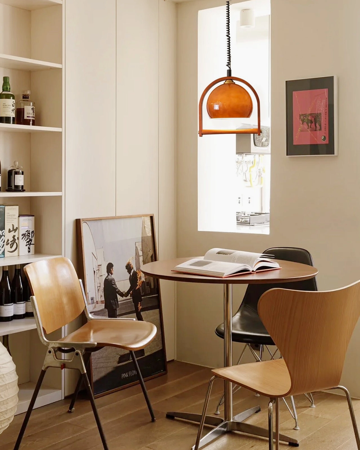 Pallade mid-century pendant lamp lifestyle photography warm lighting ambiance home decor