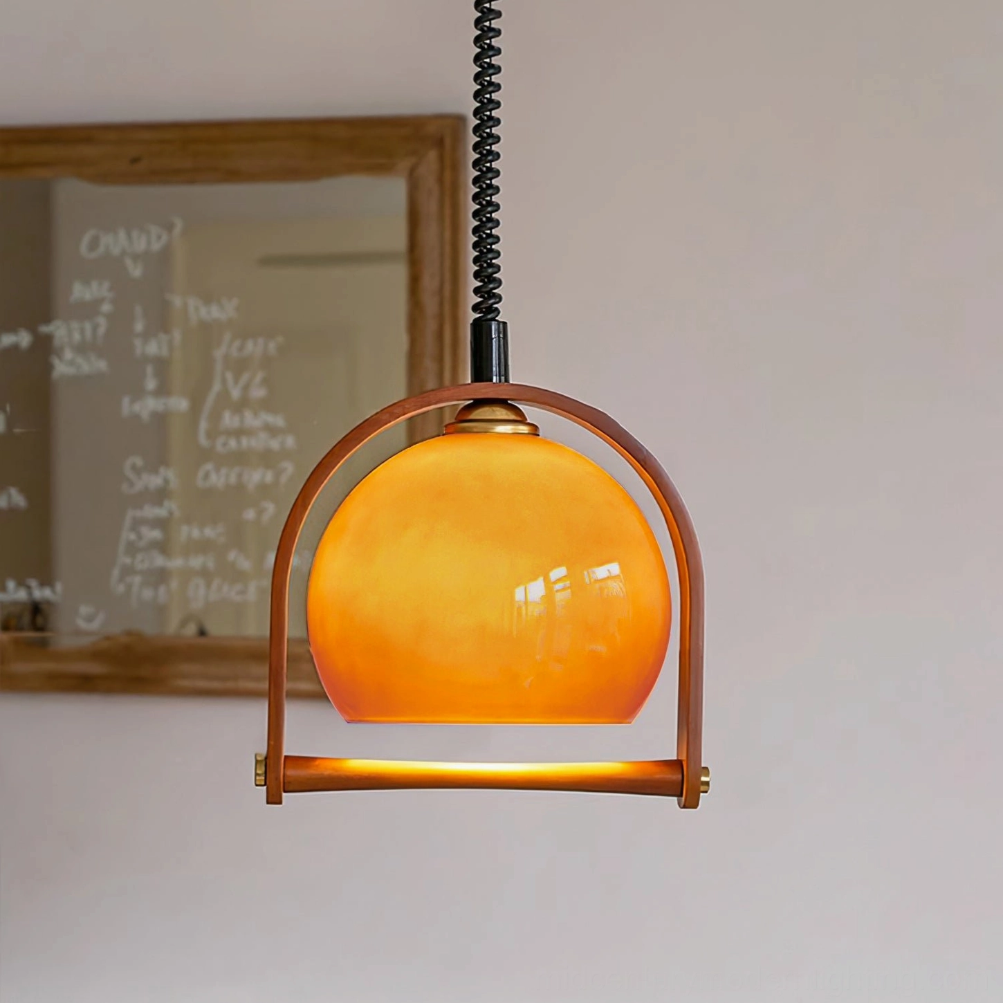 Pallade coffee pendant lamp detail with brass hardware and black spiral cord close-up