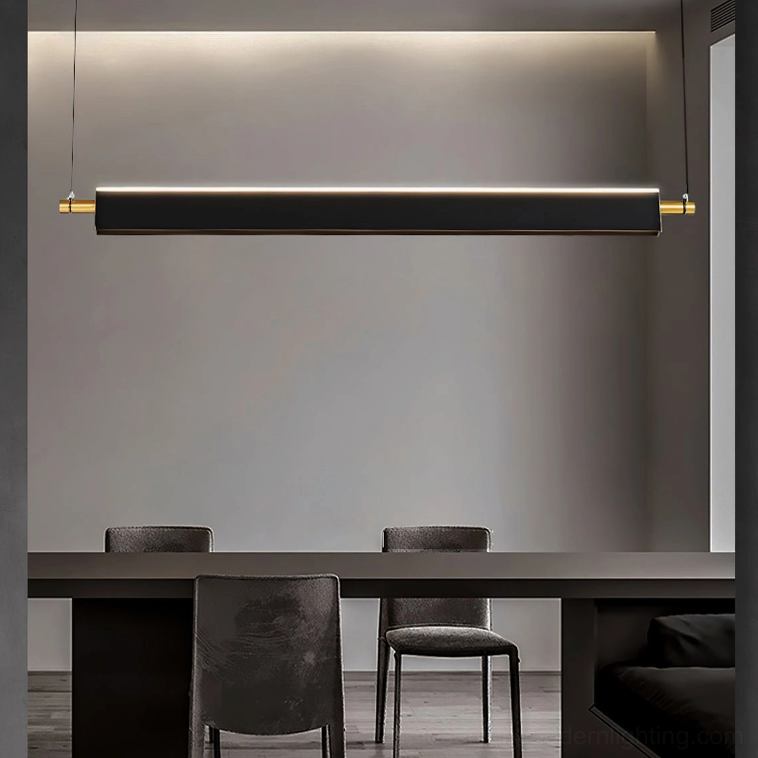 Illuminated black linear chandelier with gold accents in dark modern dining room - moody ambient lighting
