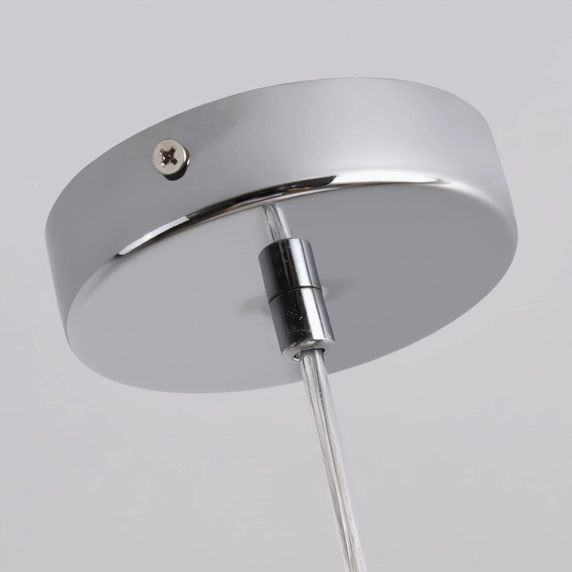 Ceiling mount fixture with polished chrome metal plate and adjustable hanging rod, top-down detail view
