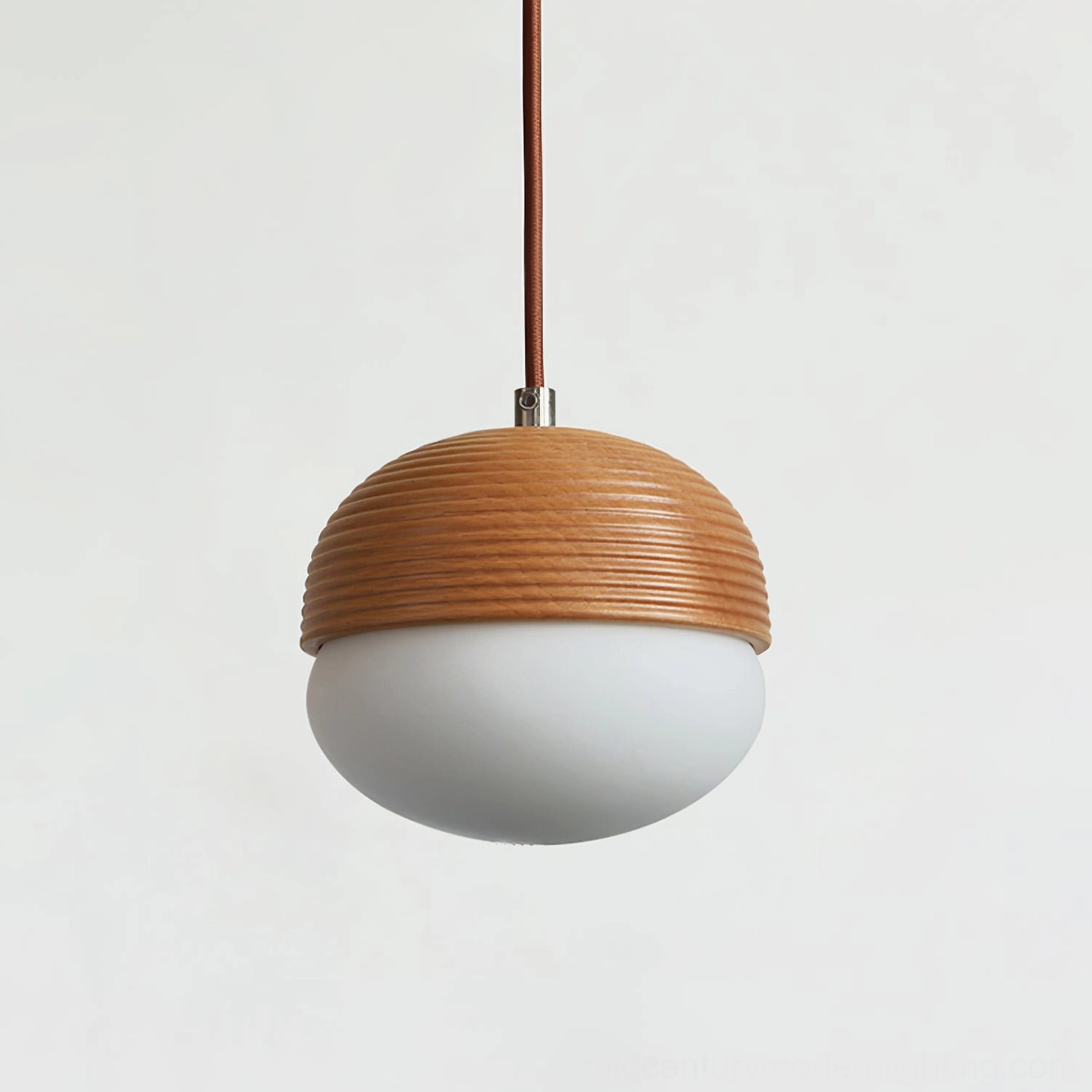 Angled side view of two-tone wood and glass pendant, architectural lighting design detail