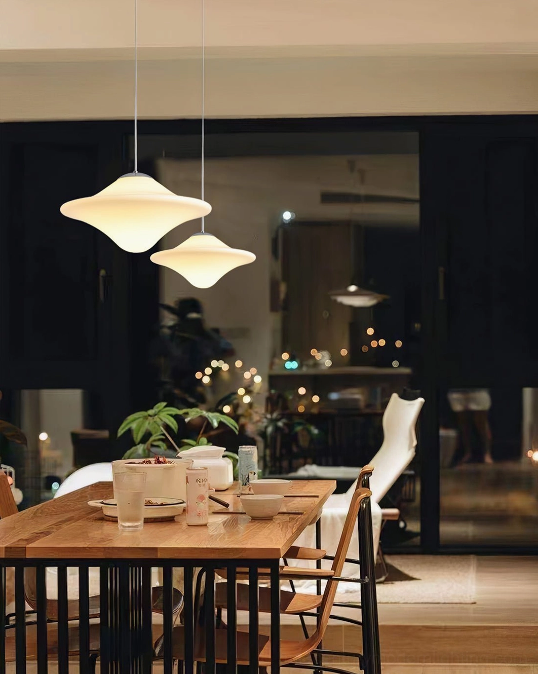 Pendant lamp with chrome metal components and opaline shade creating sophisticated lighting solution