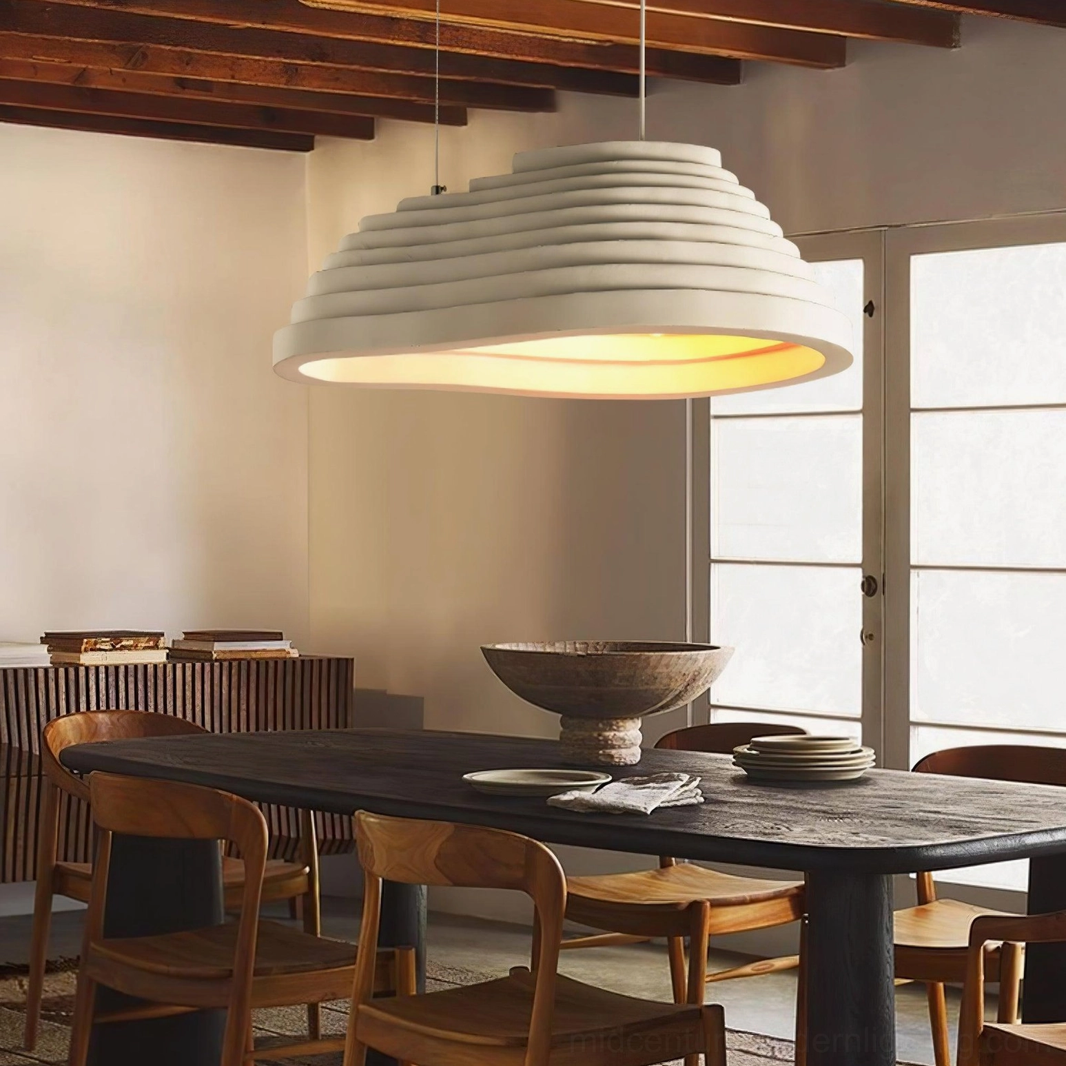 Side view of layered pendant light in vintage wooden dining room with minimalist rustic warm decor