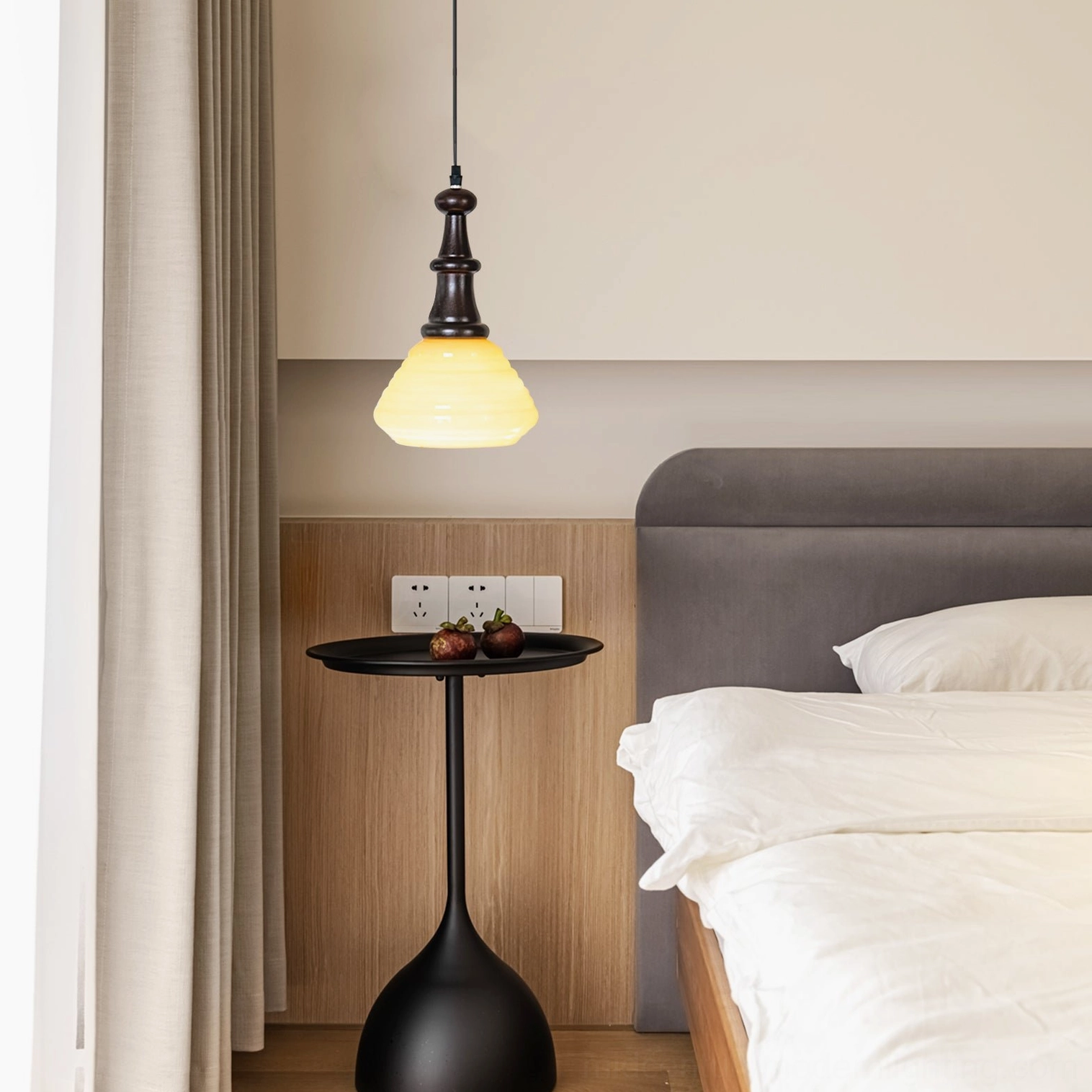 Wooden pendant light in minimalist modern bedroom creating cozy warm ambient lighting above neutral bedside decor