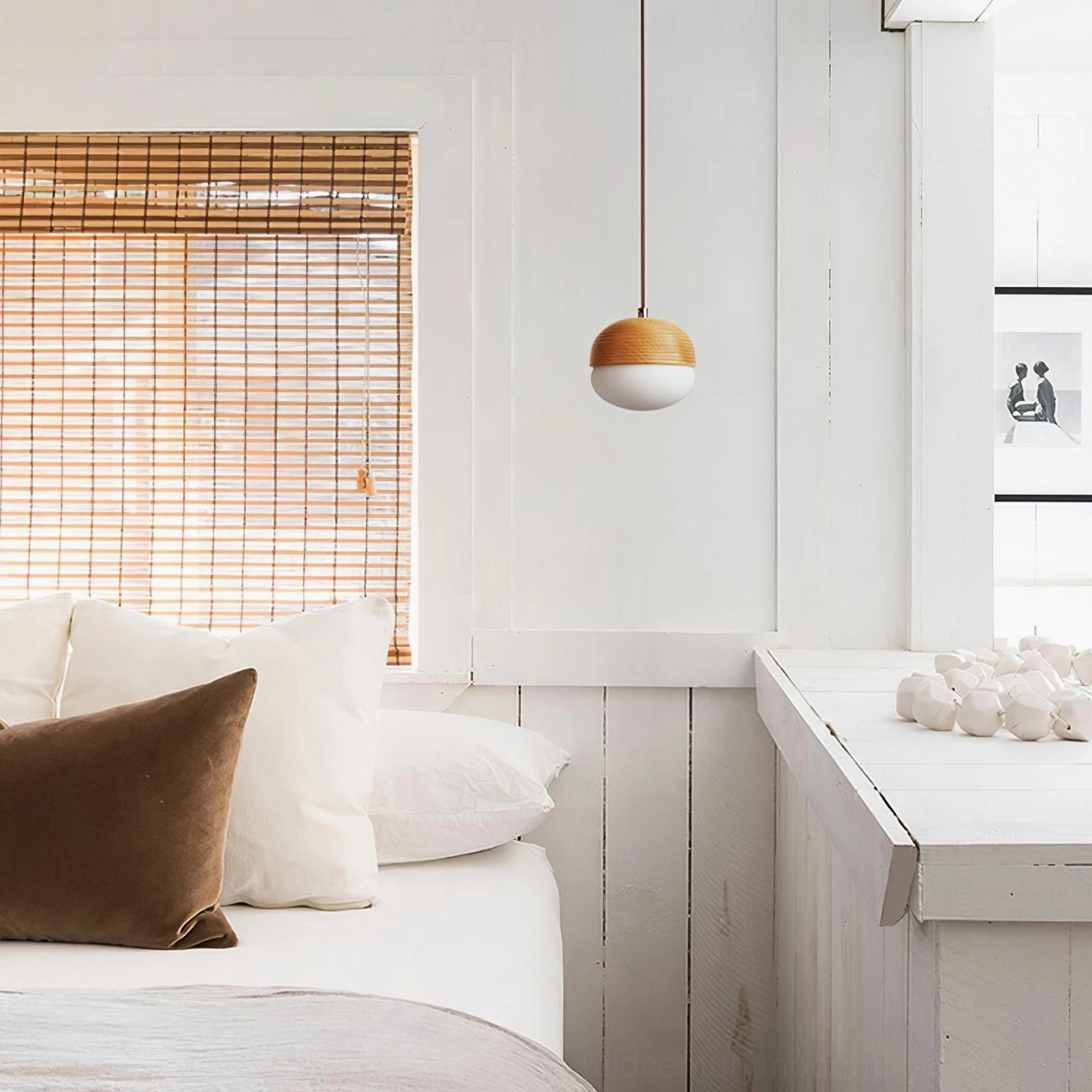 Pendant light fixture in bright Nordic bedroom with bamboo blinds, clean contemporary home design aesthetic