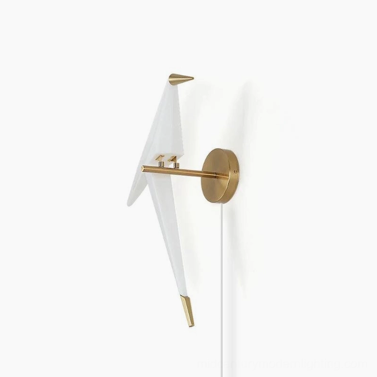 Perching Bird wall lamp minimalist design with white fabric shade and gold metal mounting hardware, front perspective