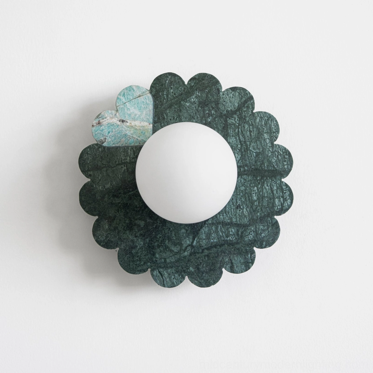 Luxury green marble petal wall lamp with hand-carved scalloped edges and light diffuser detail