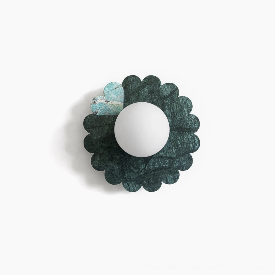 Petal marble wall sconce front view with deep green stone and frosted glass globe on white background