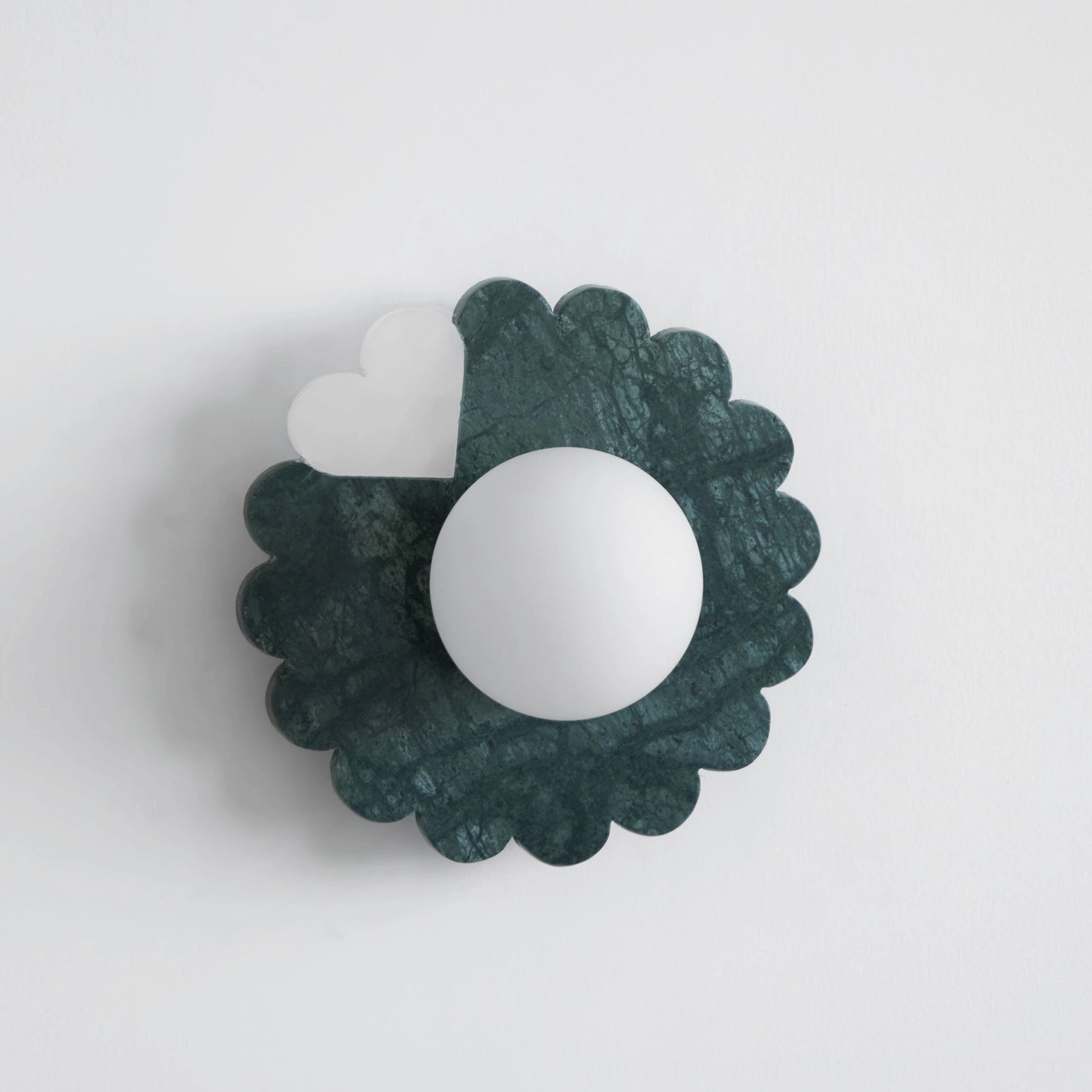 Sculptural petal marble wall sconce showcasing natural stone veining and craftsmanship
