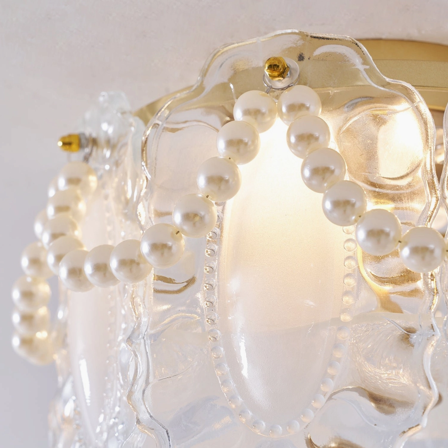 Petal Pearl light fixture creating ambient illumination in bedroom setting