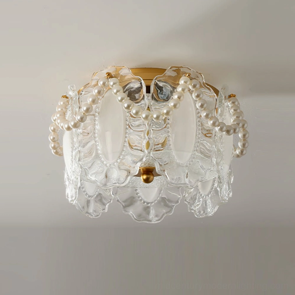 Petal Pearl ceiling light unlit showing clear glass petals with gold hardware and pearl strands