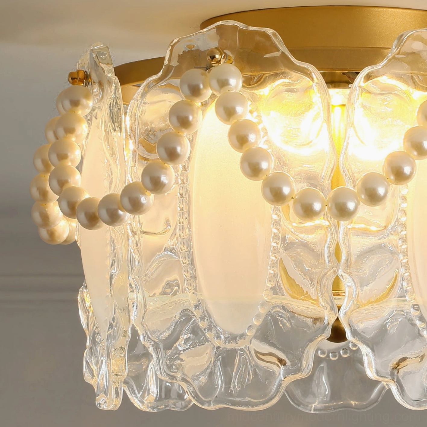 Close-up detail of Petal Pearl light showing textured glass petals and faux pearl accents