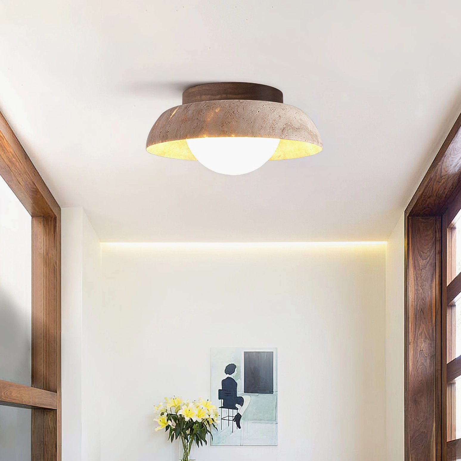Piedra flush mount light in modern hallway corner with wood window frame and contemporary wall art