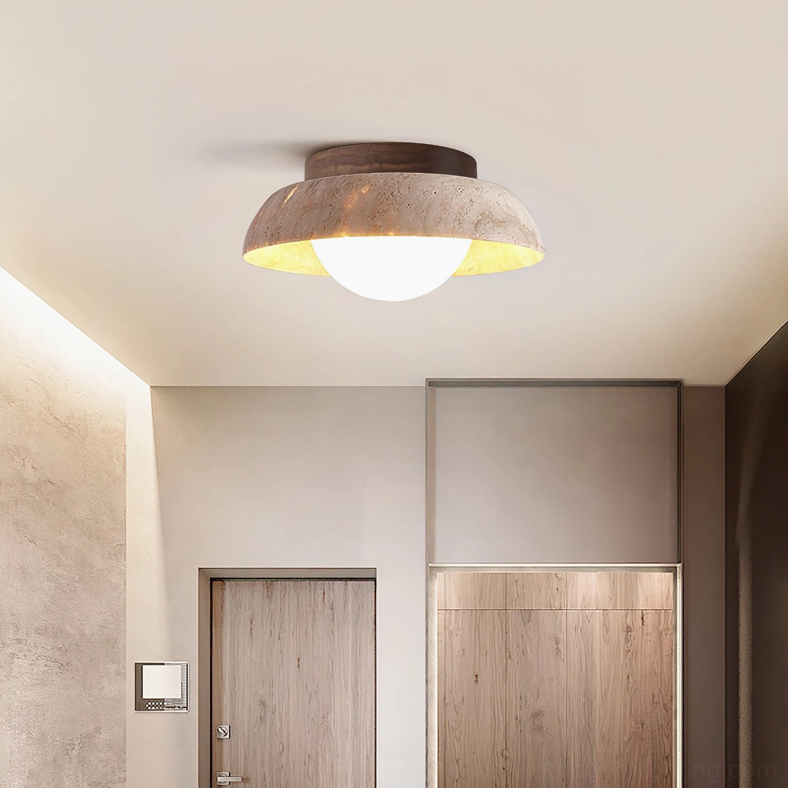 Piedra ceiling light installed in minimalist residential entryway with wood-trimmed interior and warm ambient glow