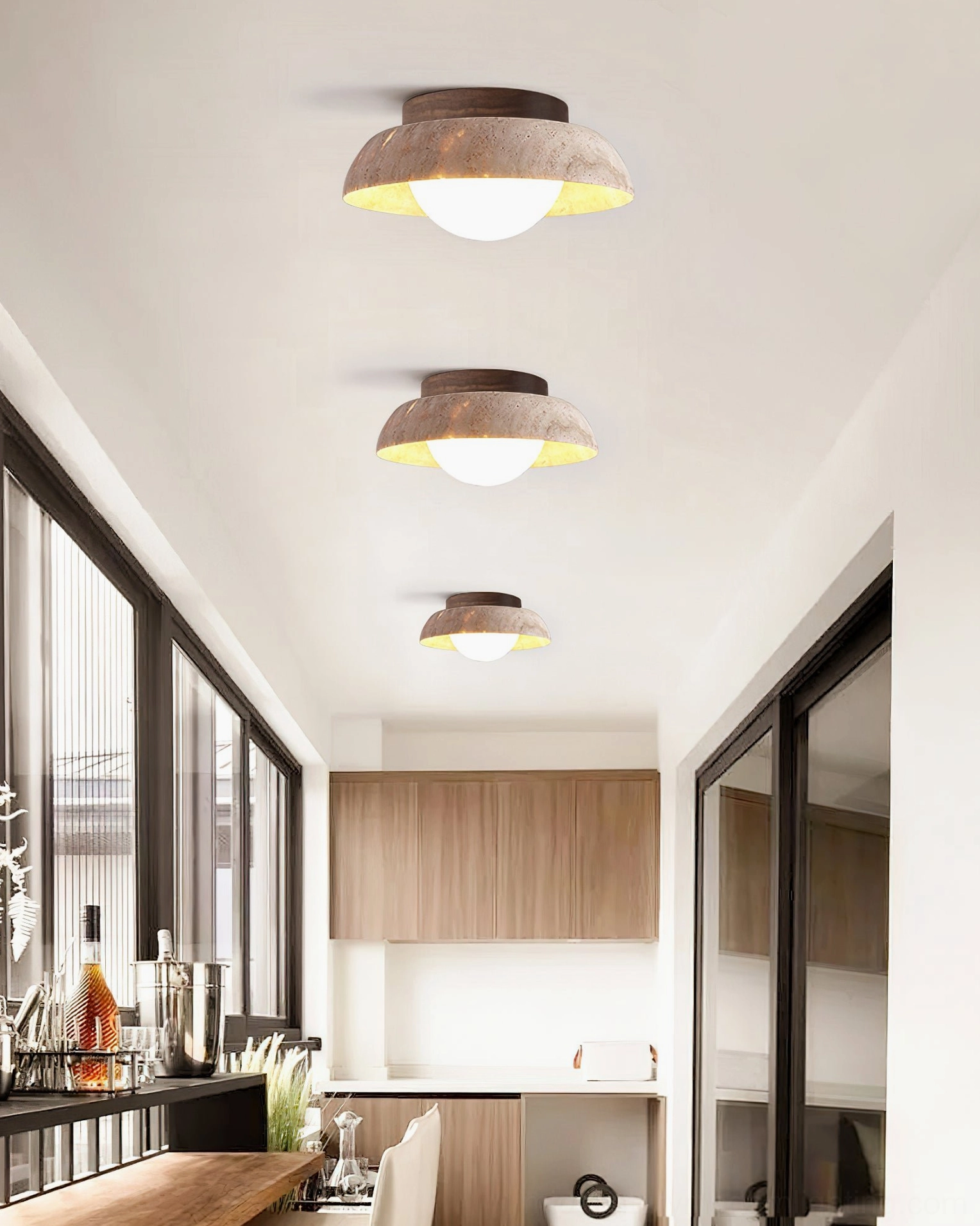 Piedra ceiling lights in modern kitchen dining area with large glass windows and contemporary countertop styling