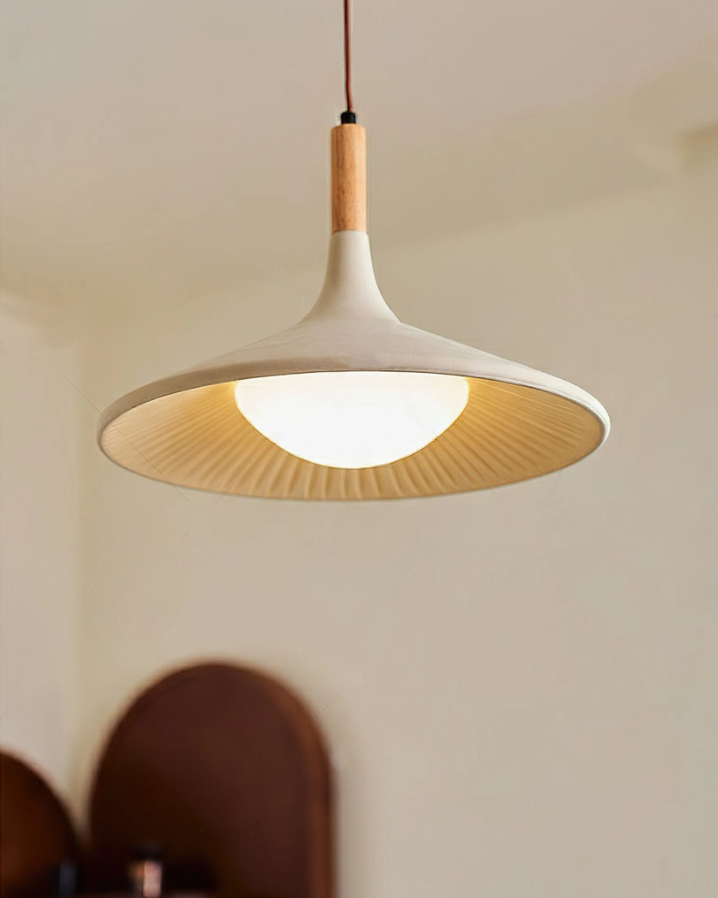 Piero pendant lamp close-up radial ribbed shade warm glowing LED light