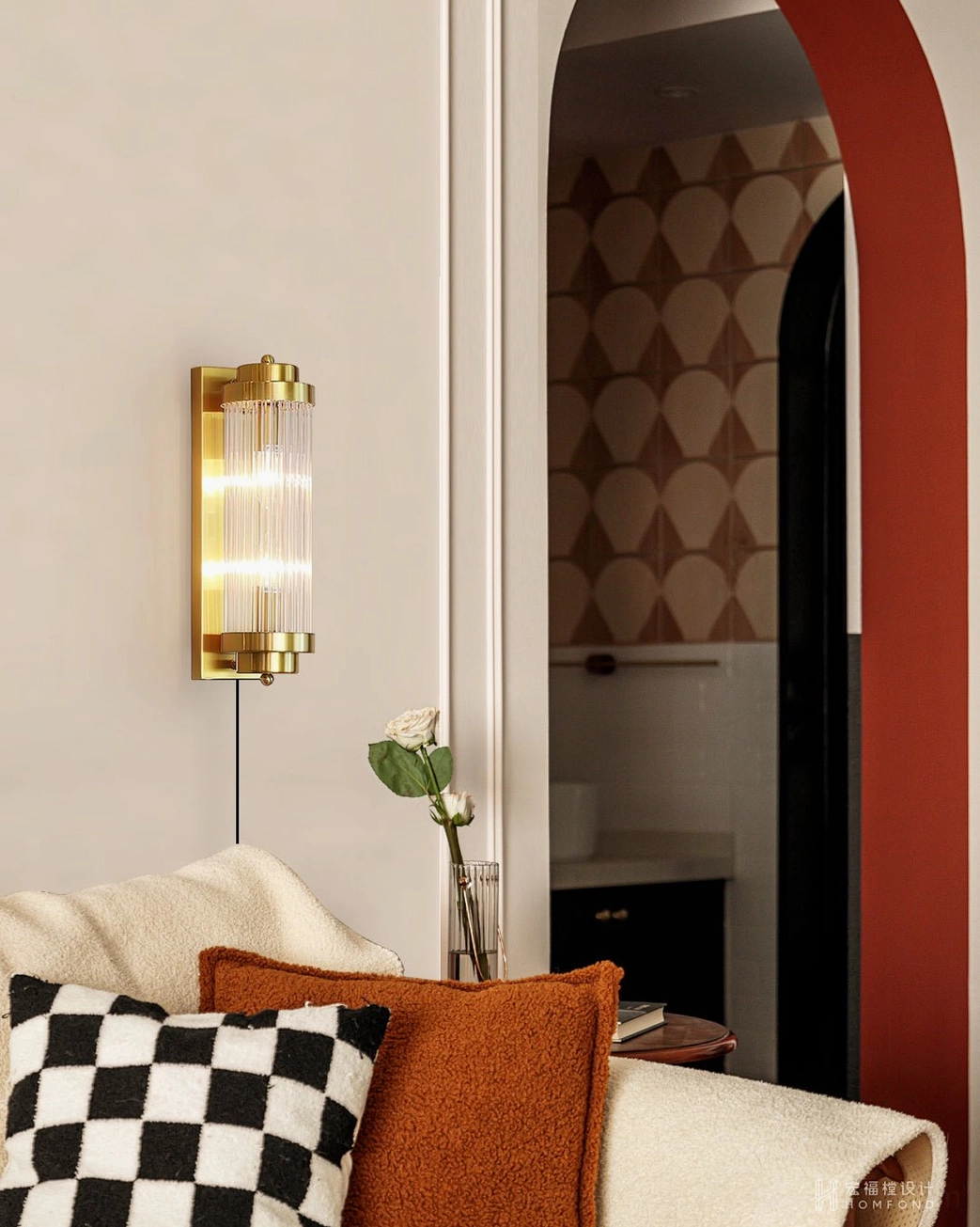 Vintage-inspired bedroom with arched doorway, wall sconce providing warm atmospheric lighting ambiance